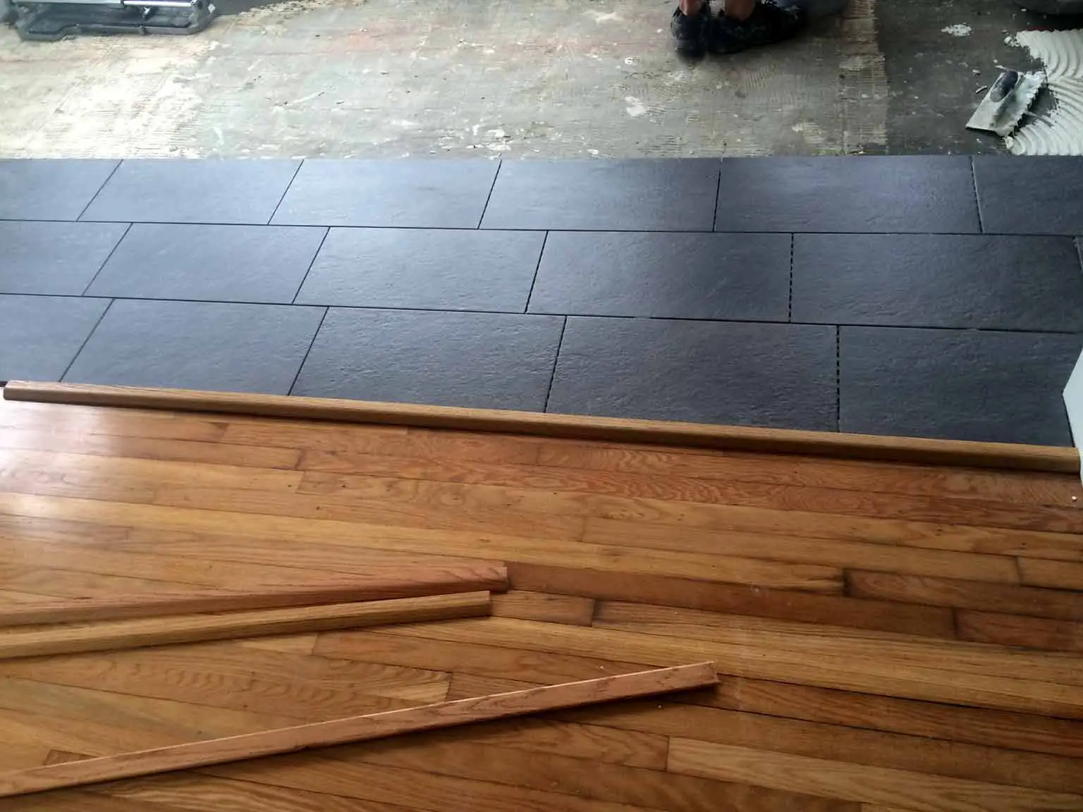 New floor tile being installed - That Homebird Life Blog