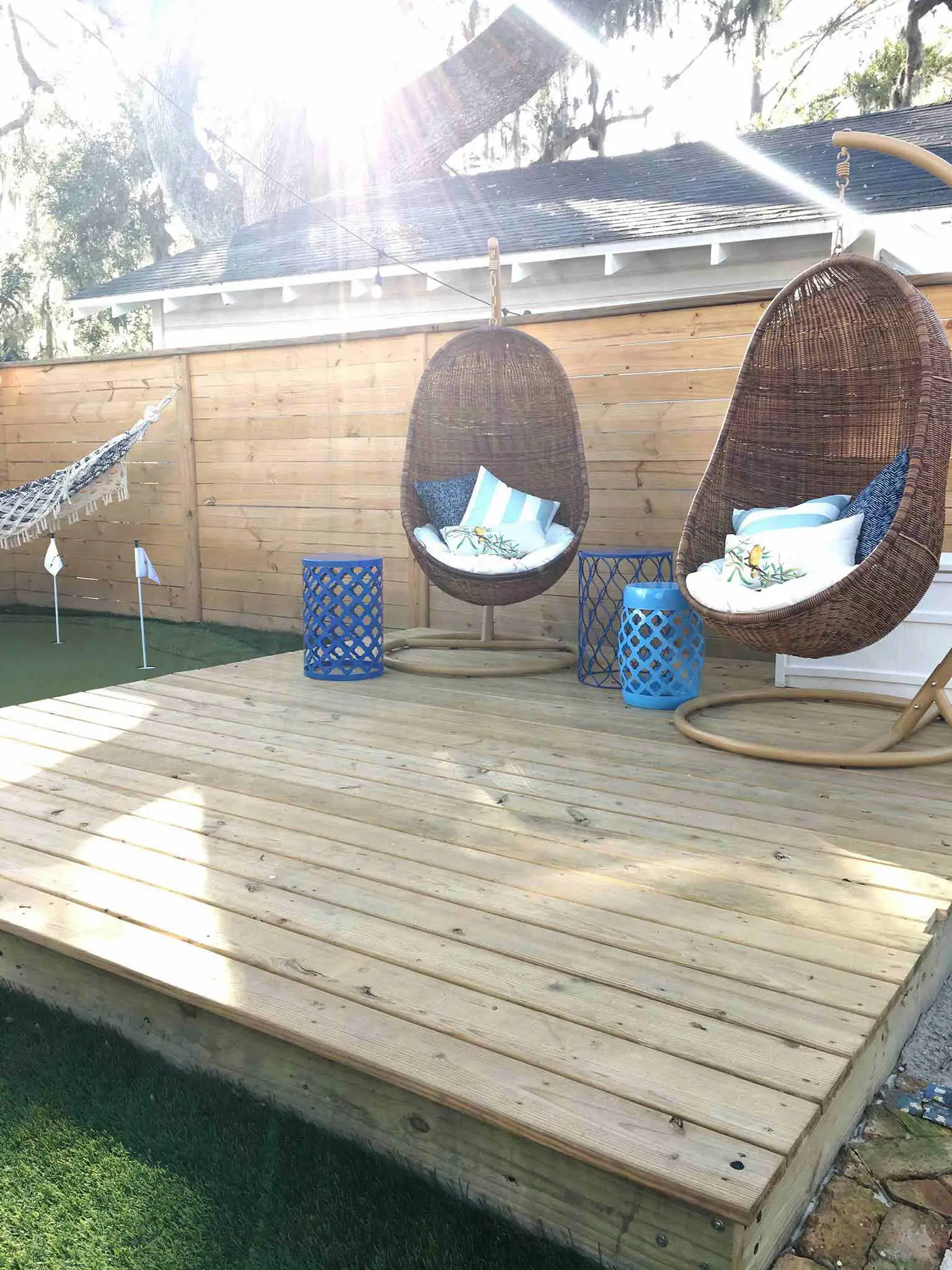 Seating area with hanging chairs - How we planned our backyard space - That Homebird Life Blog