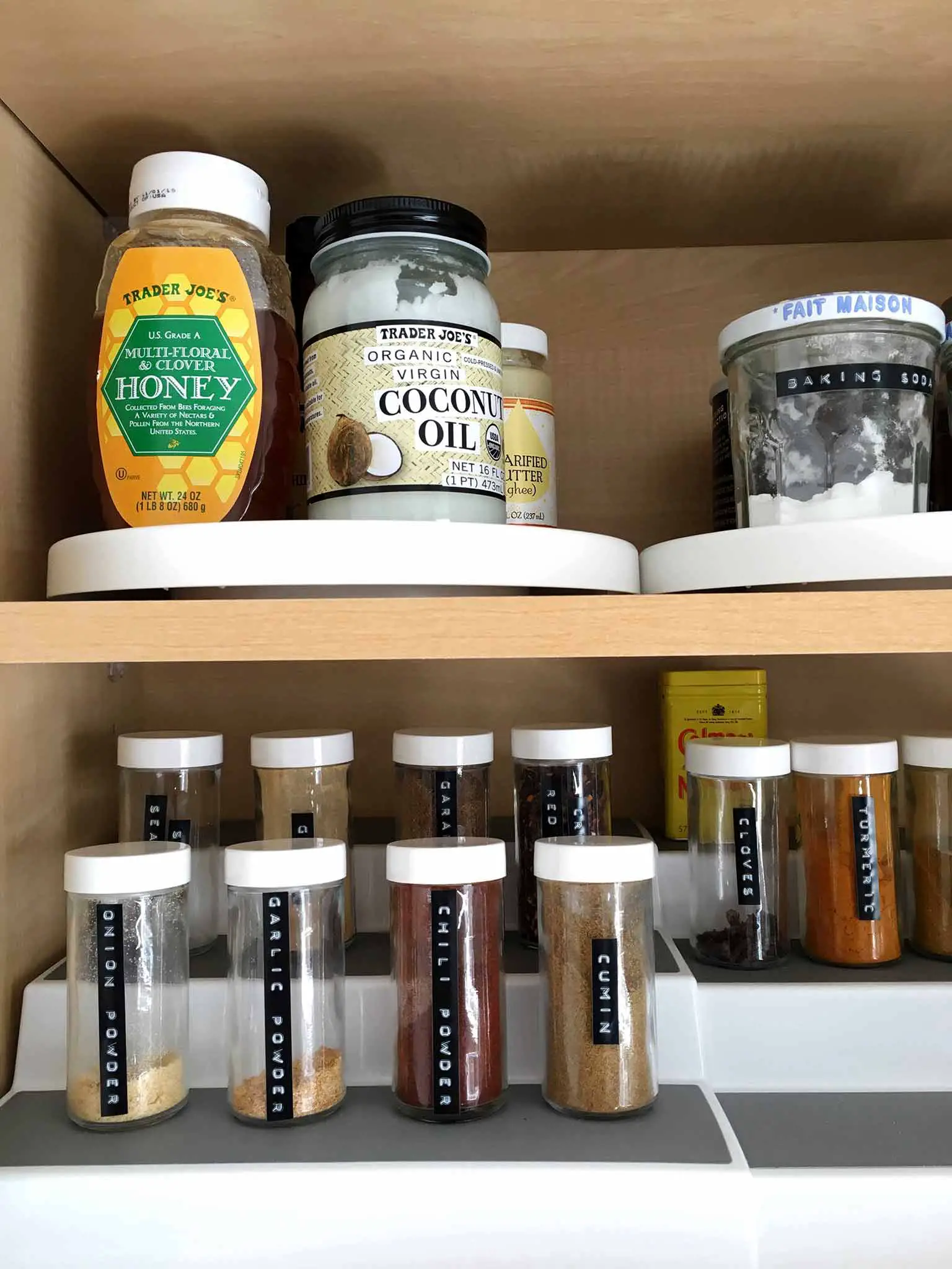 Organized kitchen cabinet with tiered spice rack - That Homebird Life Blog