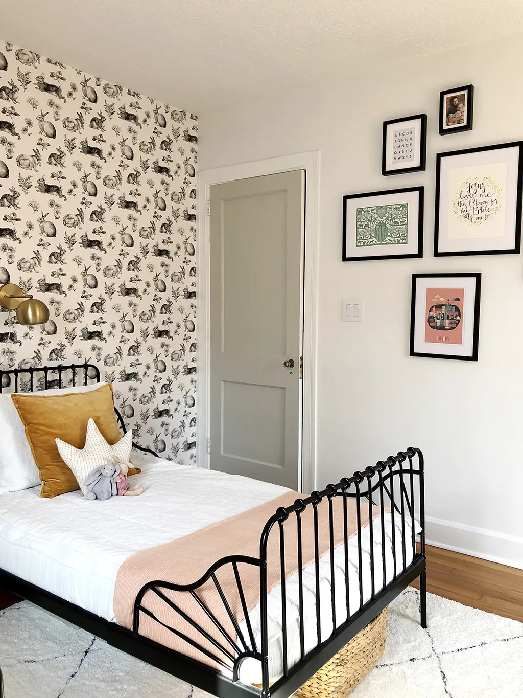 gallery wall and twin bed