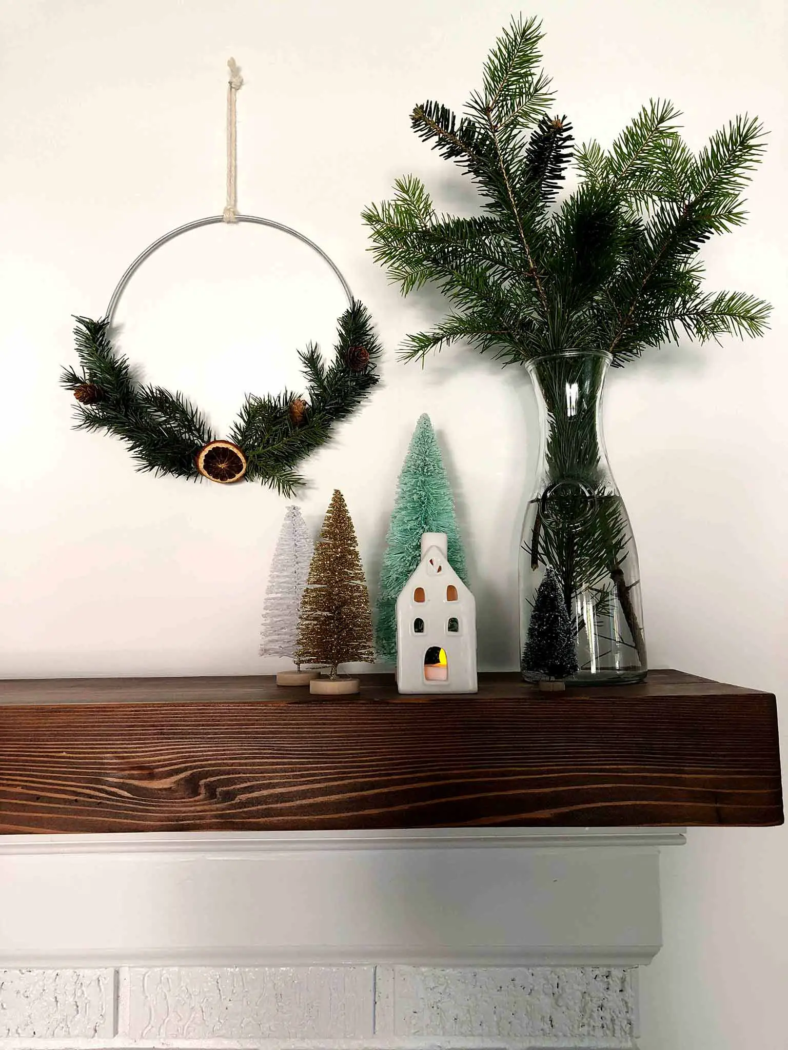 Mantel with hoop wreaths and bottle brush trees - Simple Yet Cozy Christmas Decor - That Homebird Life Blog #christmasdecor #christmasinspiration