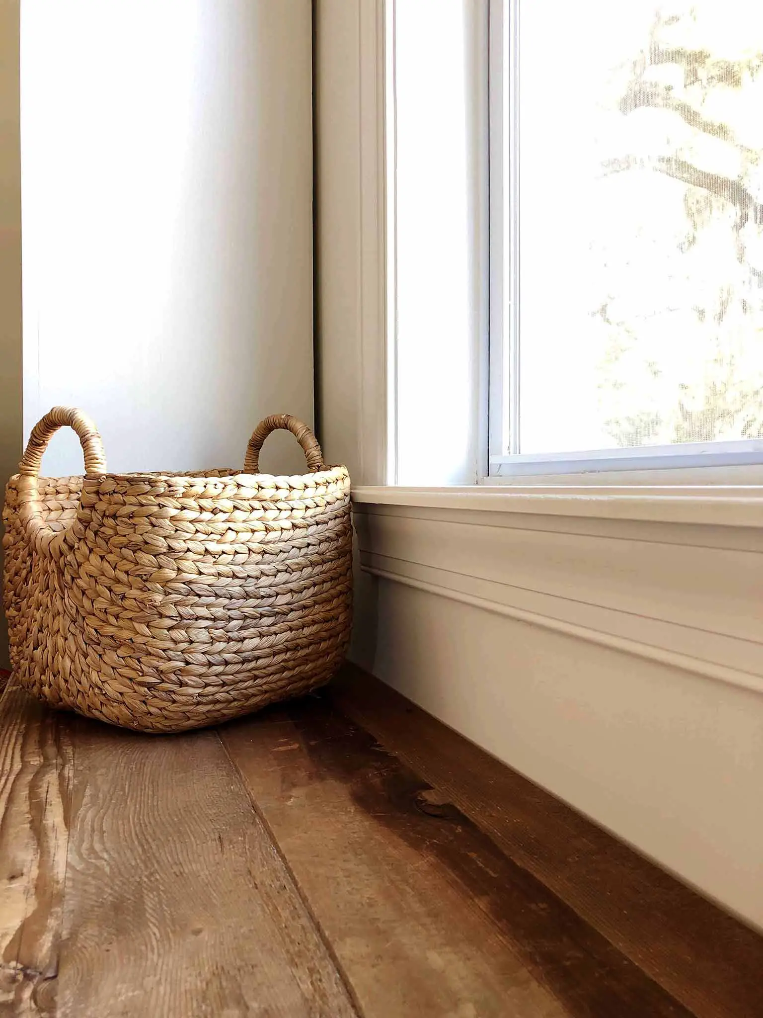 Basket on a window bench for toy storage