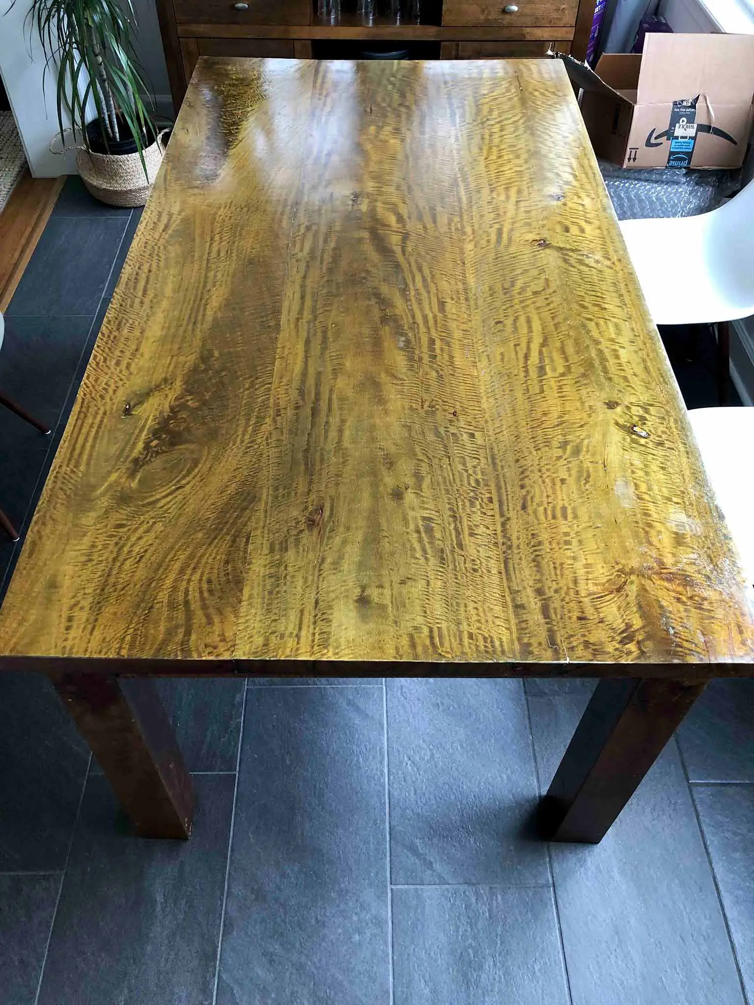 dark wood dining table before refinishing