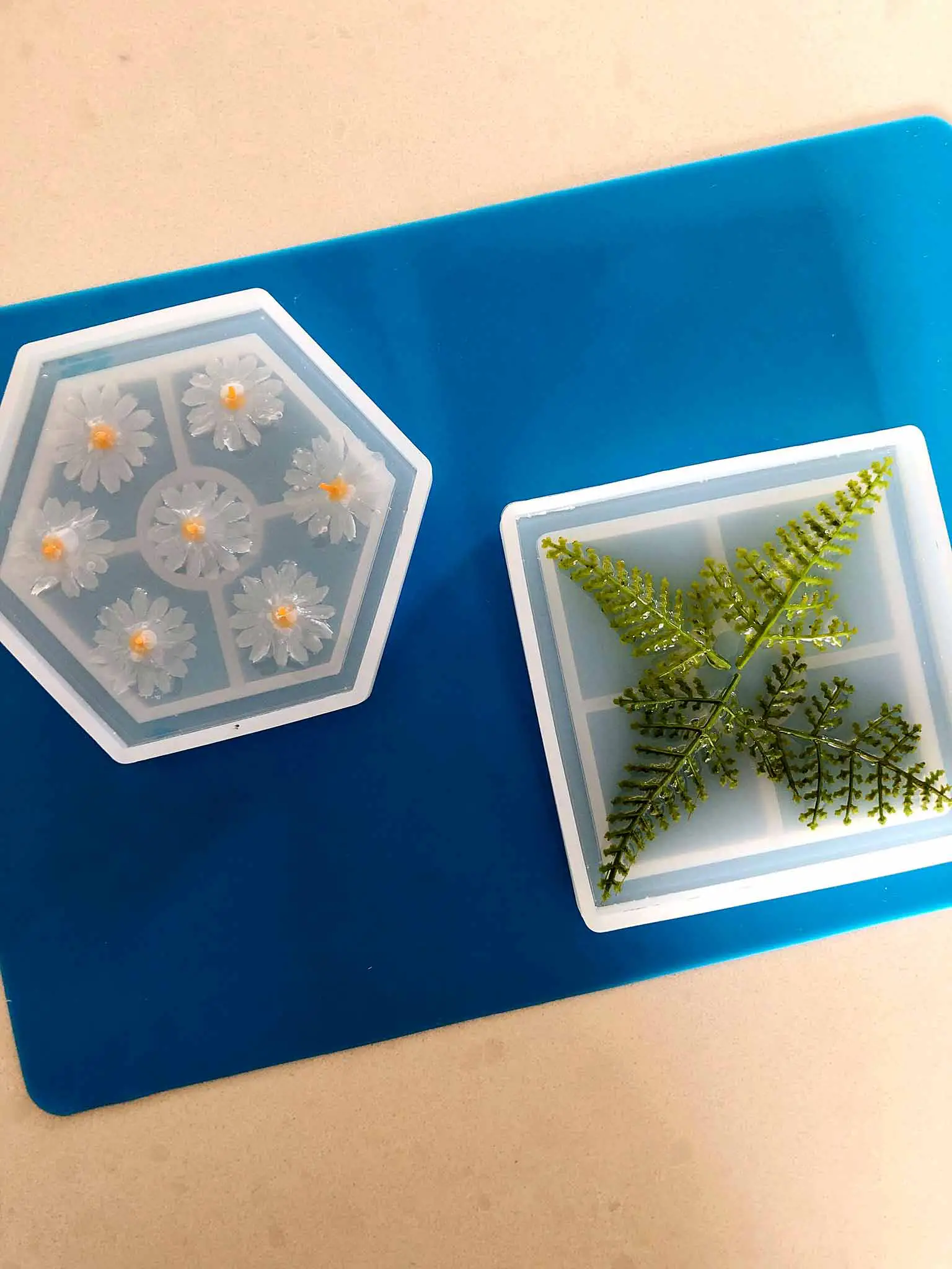 embedding faux greenery and flowers in craft resin