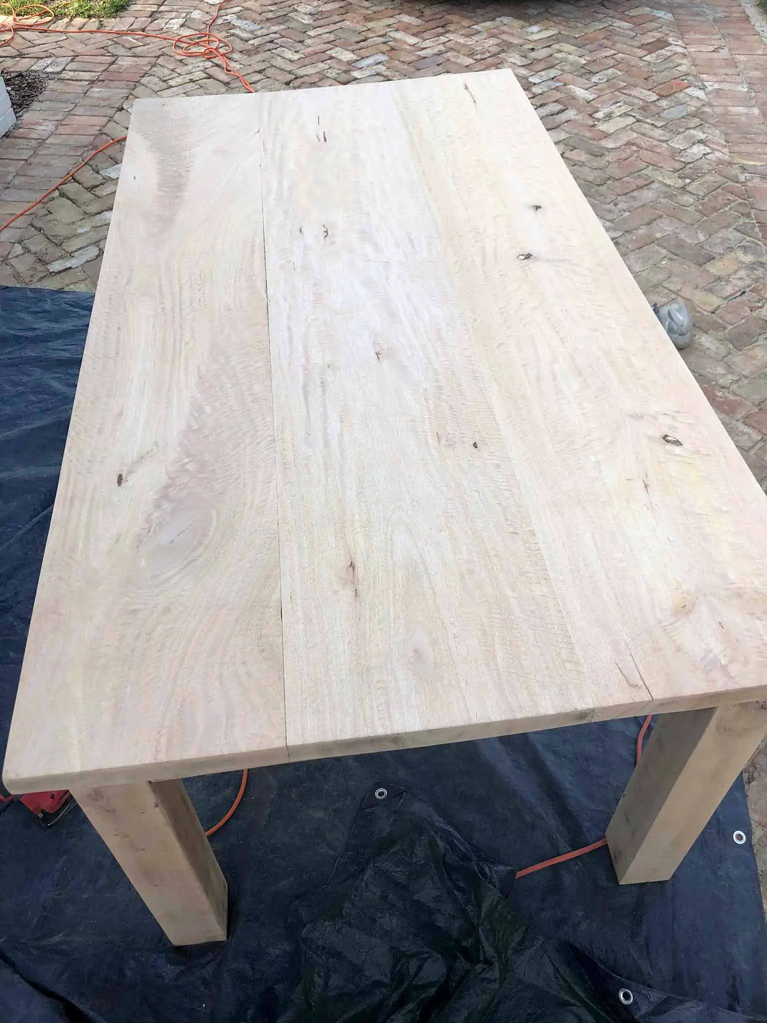 wood table after stripping and sanding