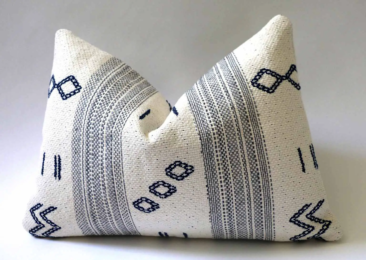 Blue and white patterned pillow