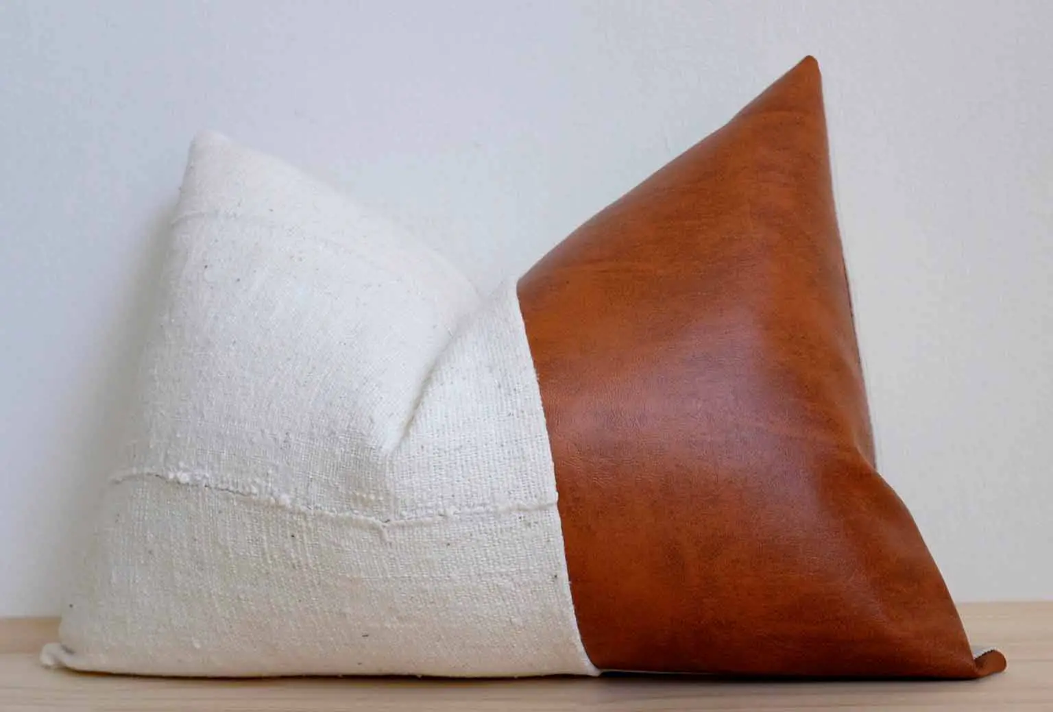 White mudcloth and leather pillow