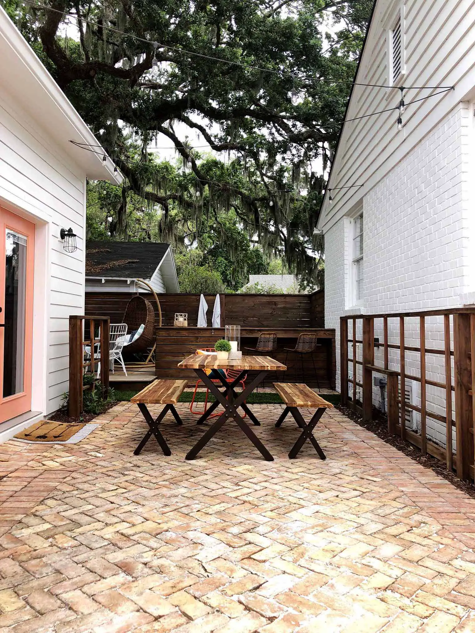 brick patio with table and benches