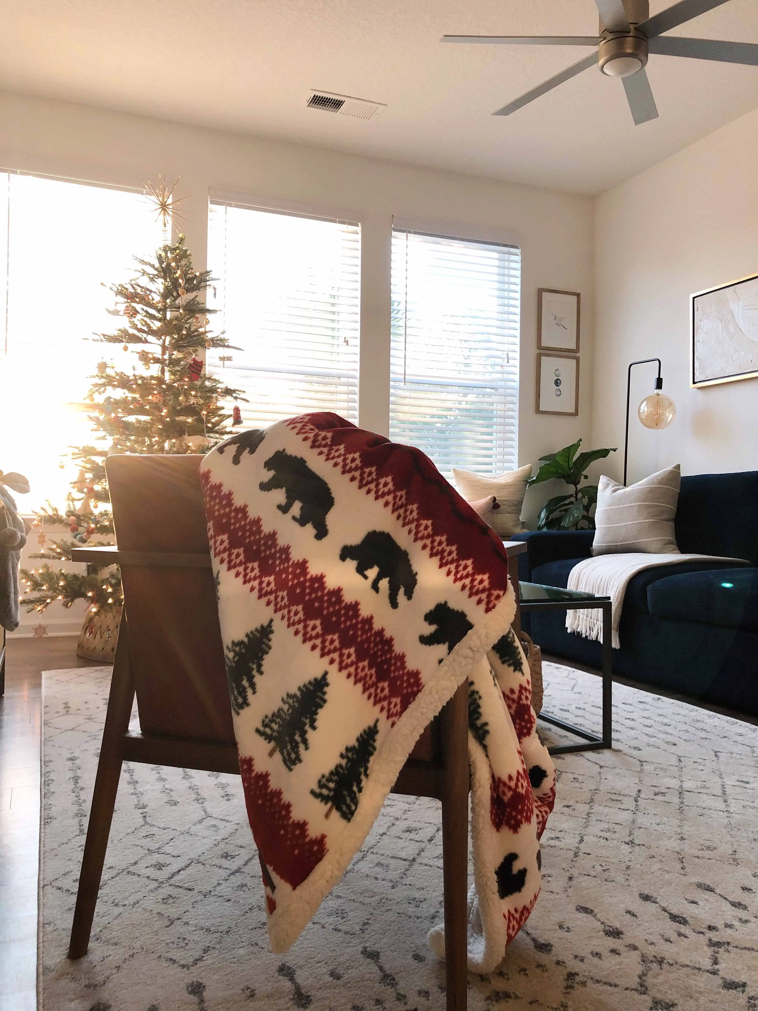 blanket on chair with christmas tree