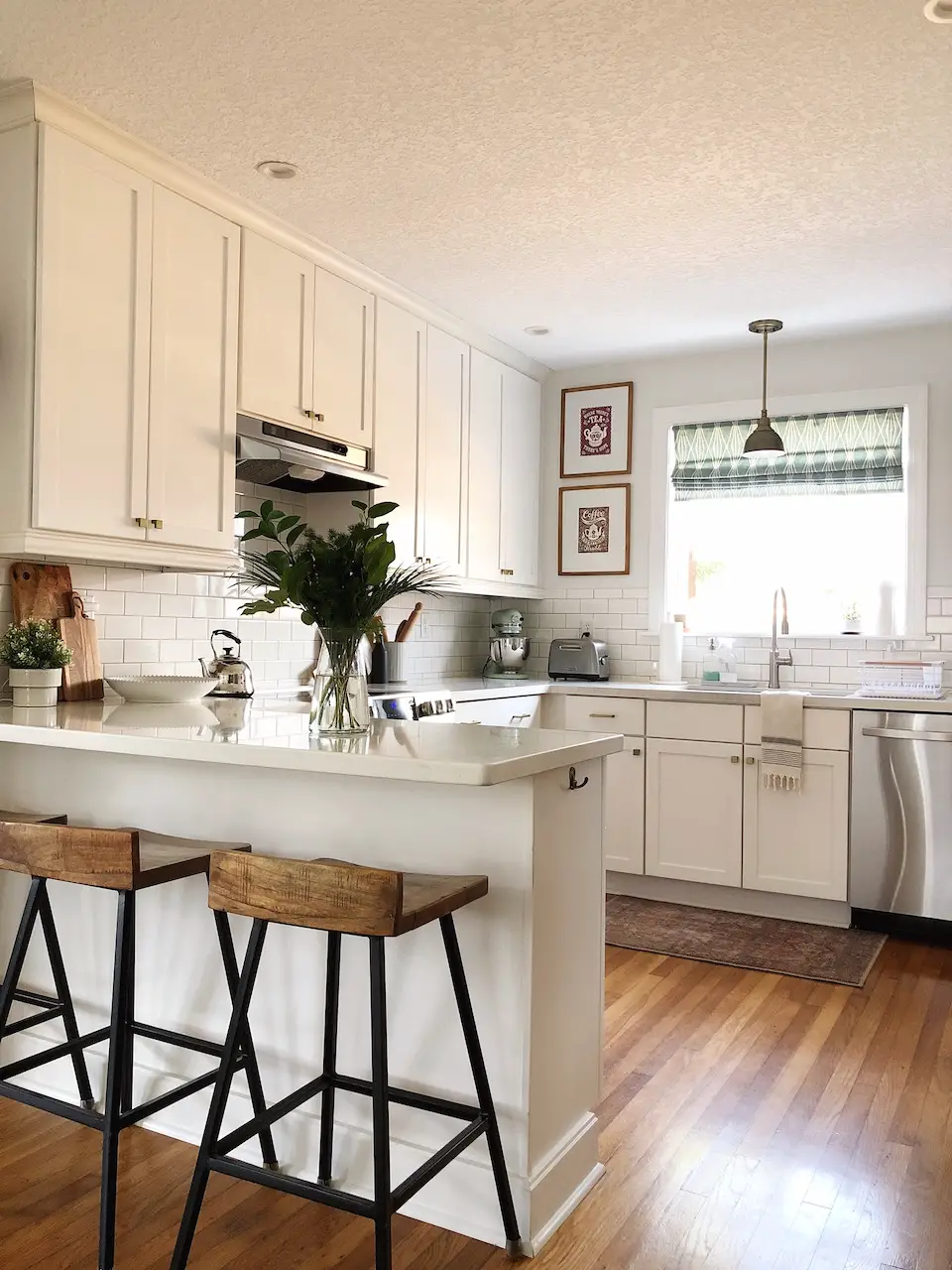 kitchen with white cabinets and white quartz tops