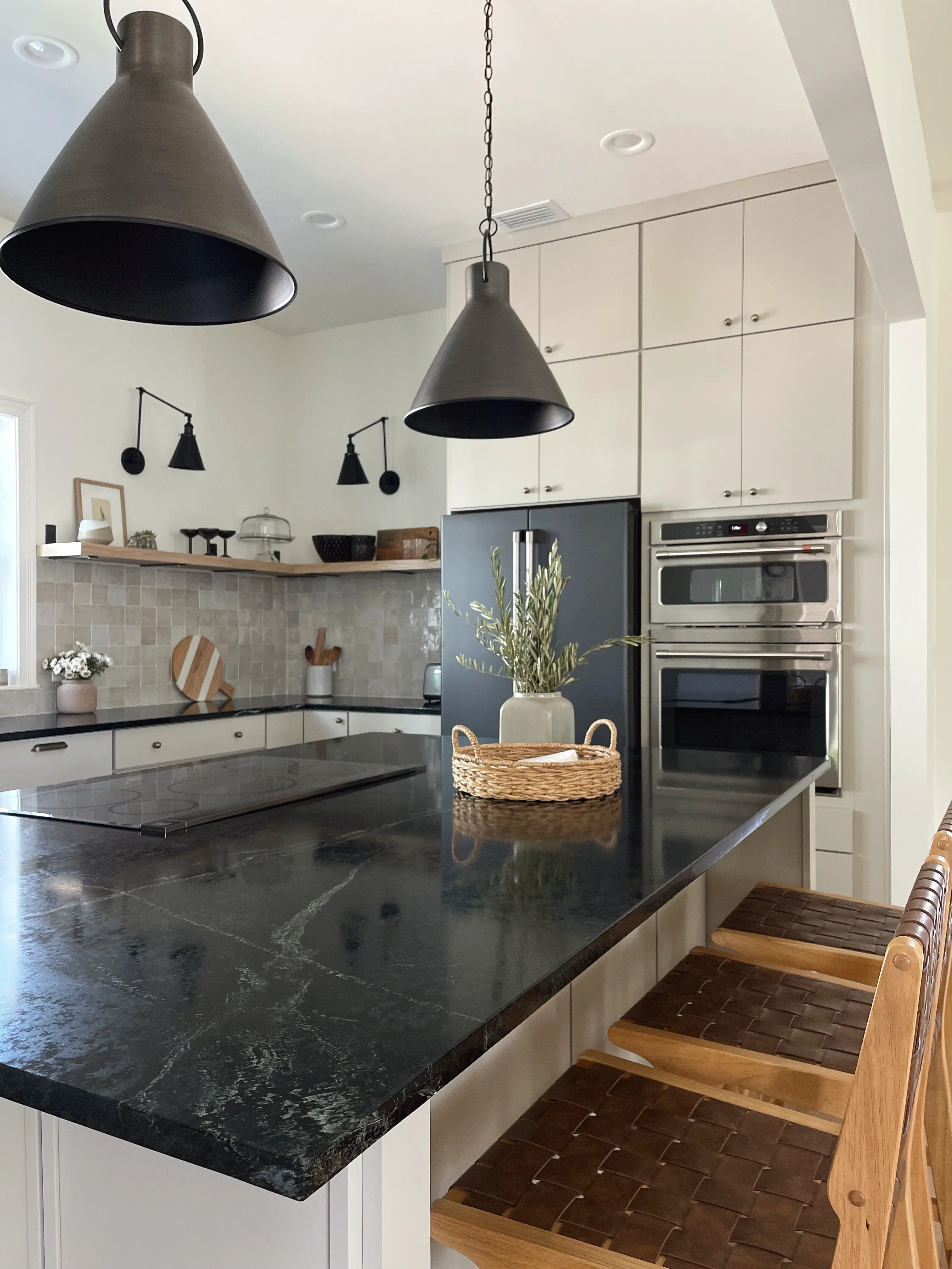 organic modern style kitchen with greige cabinets and soapstone countertops