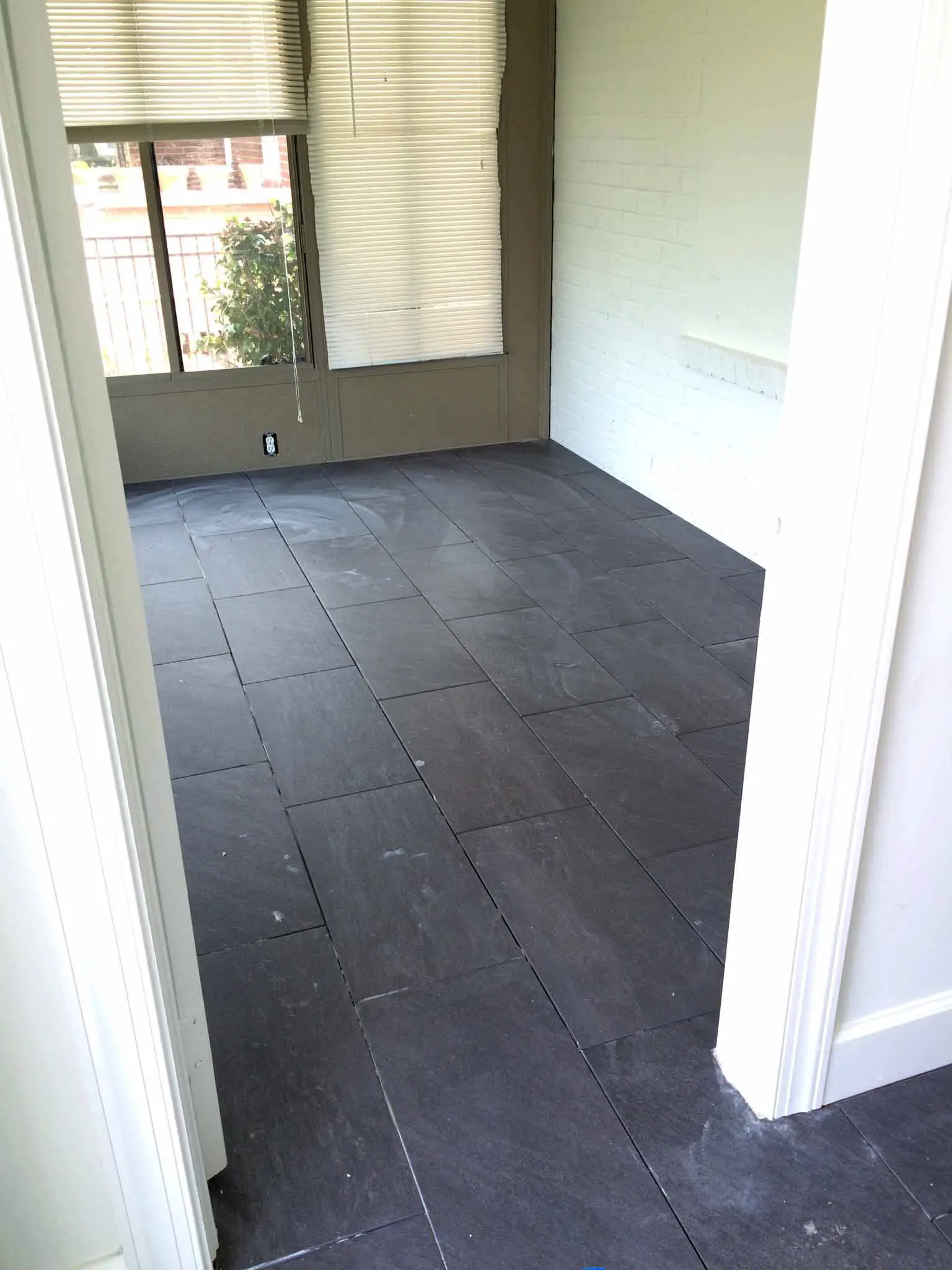 Floor Tile Being Installed - That Homebird Life