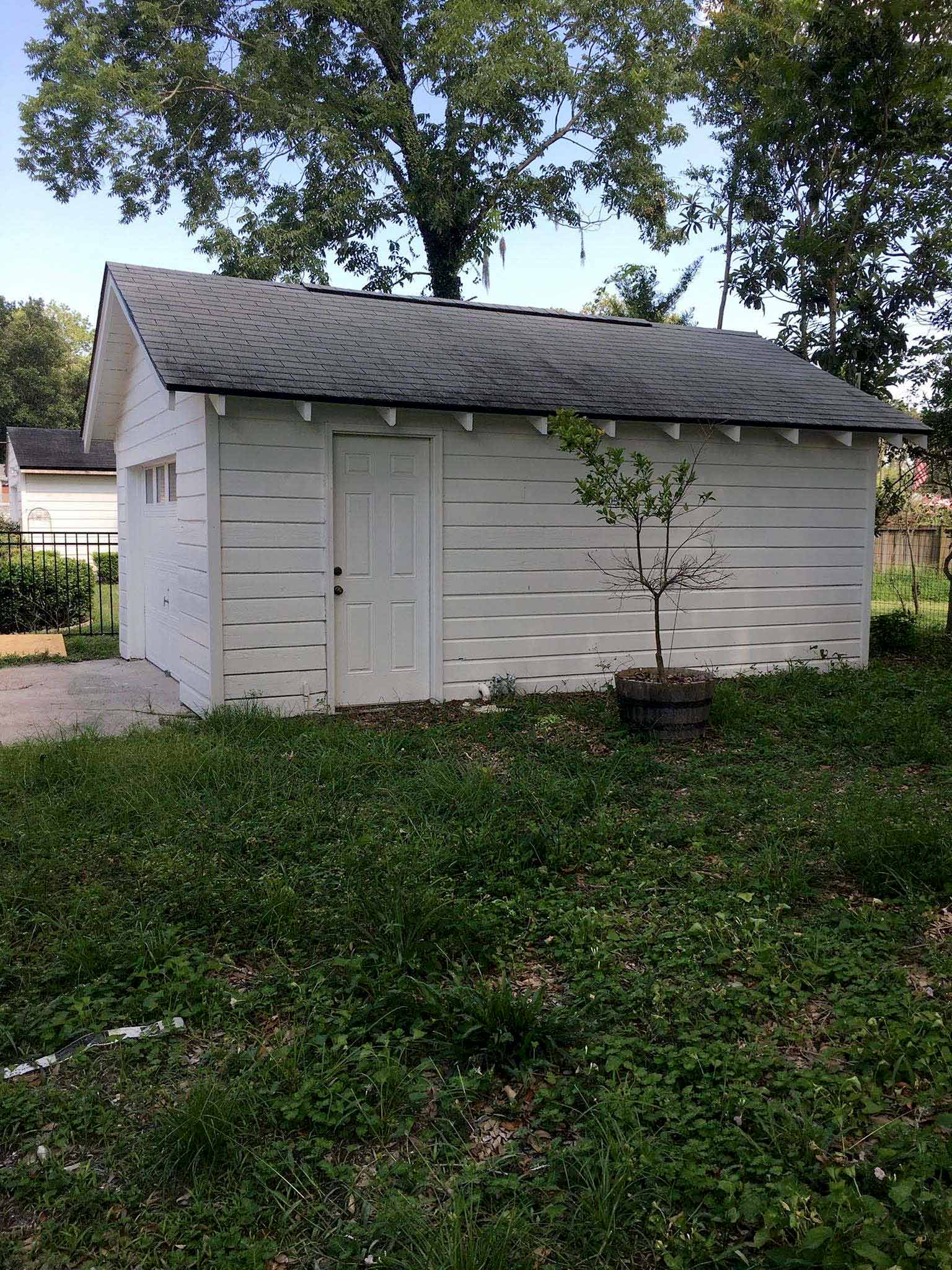 Before photo of the backyard and garage - That Homebird Life Blog