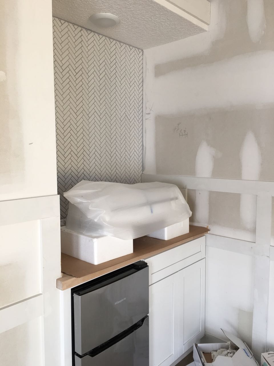 White ceramic herringbone tile backsplash for the kitchenette - That Homebird Life Blog