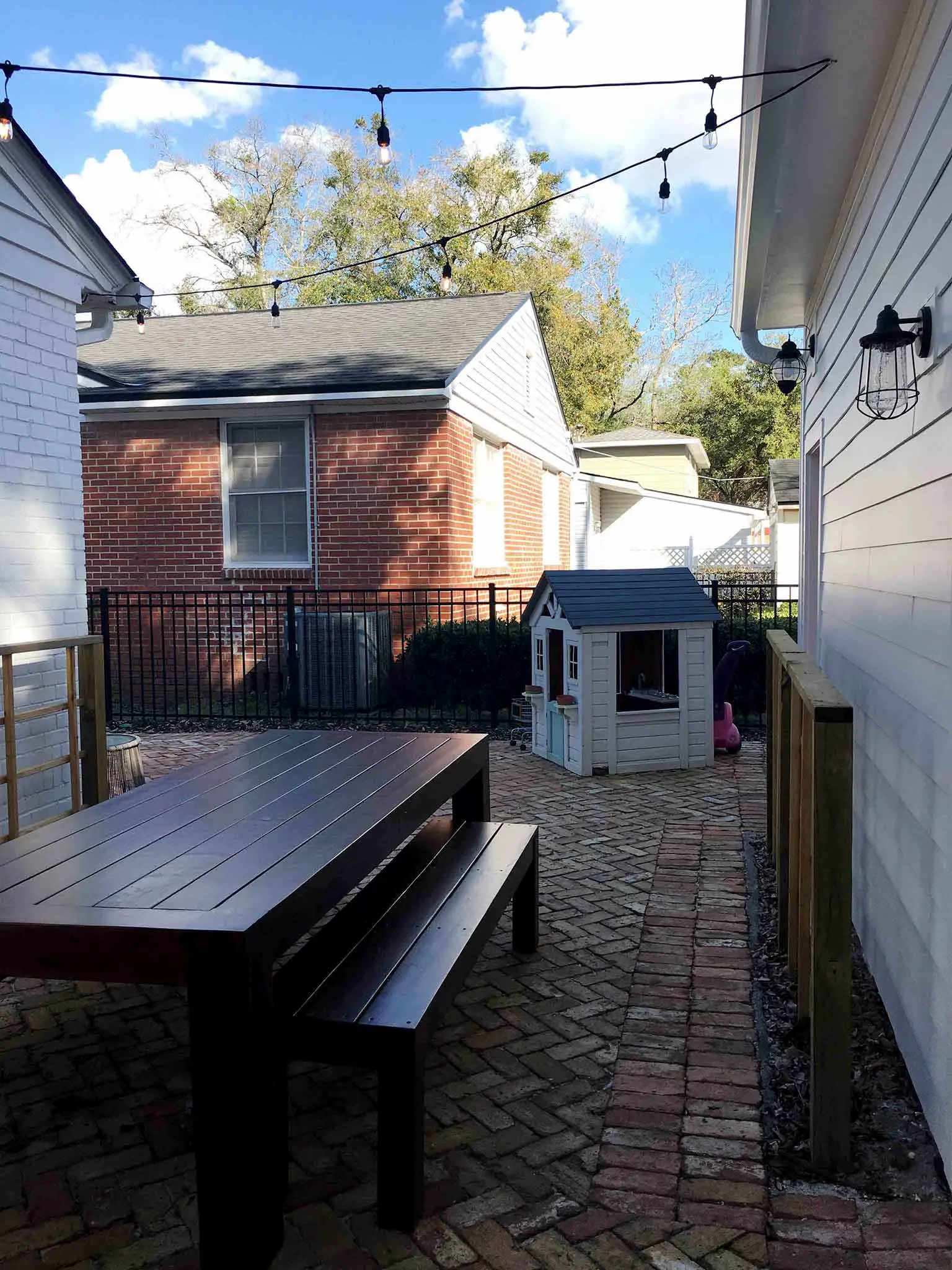 Dining area with reclaimed brick paver patio - How we planned our backyard space - That Homebird Life Blog