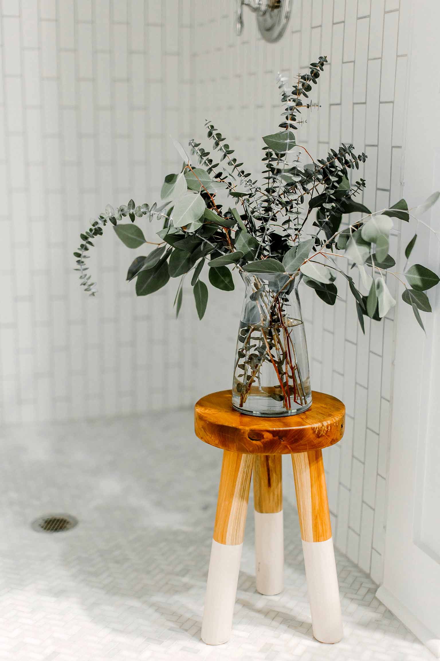 Vertical subway tile shower with marble herringbone floor - The Guest House Reveal - That Homebird Life Blog