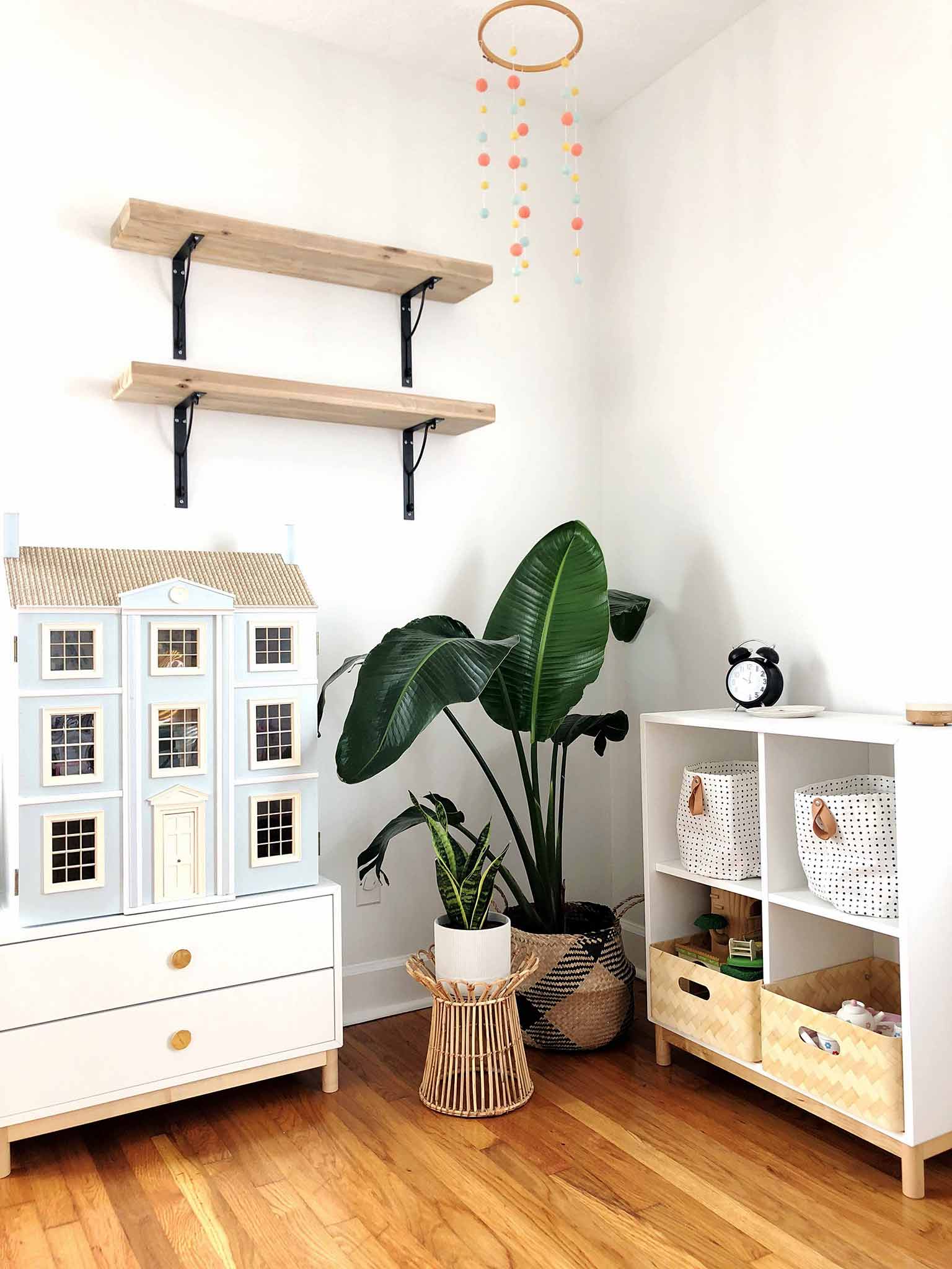 Corner of girls bedroom with wall shelves, plants, doll house and IKEA EKET storage - Guest Participant of the One Room Challenge - That Homebird Life Blog