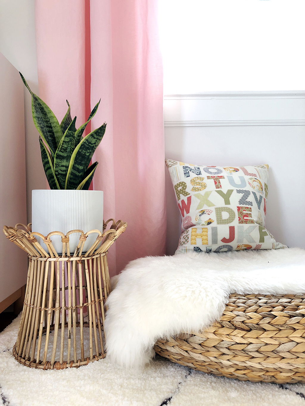 woven footstool and plant