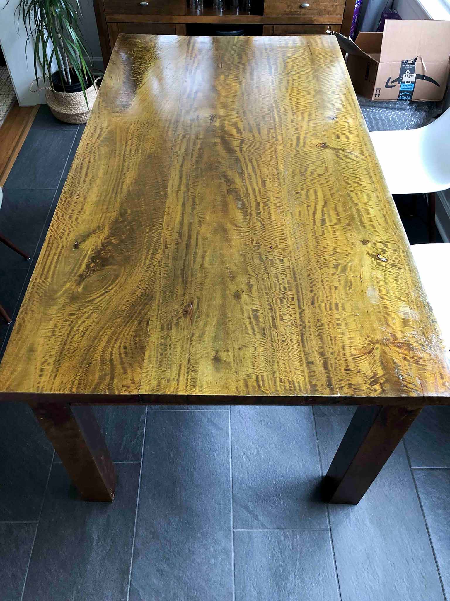 dark wood dining table before refinishing