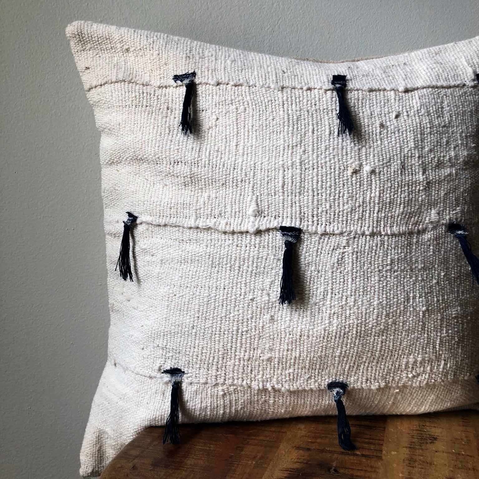 Mudcloth pillow with blue tassels