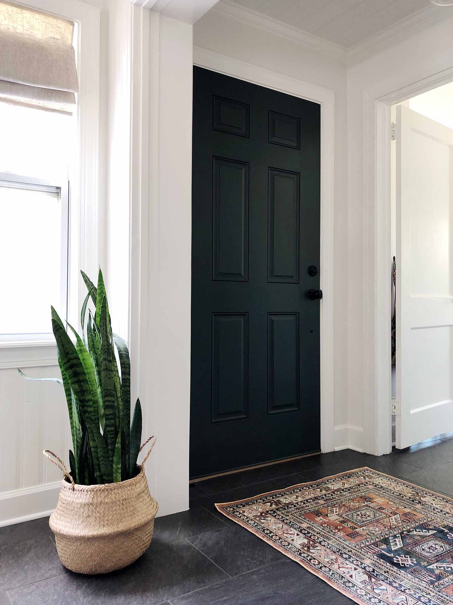 entryway with dark green door