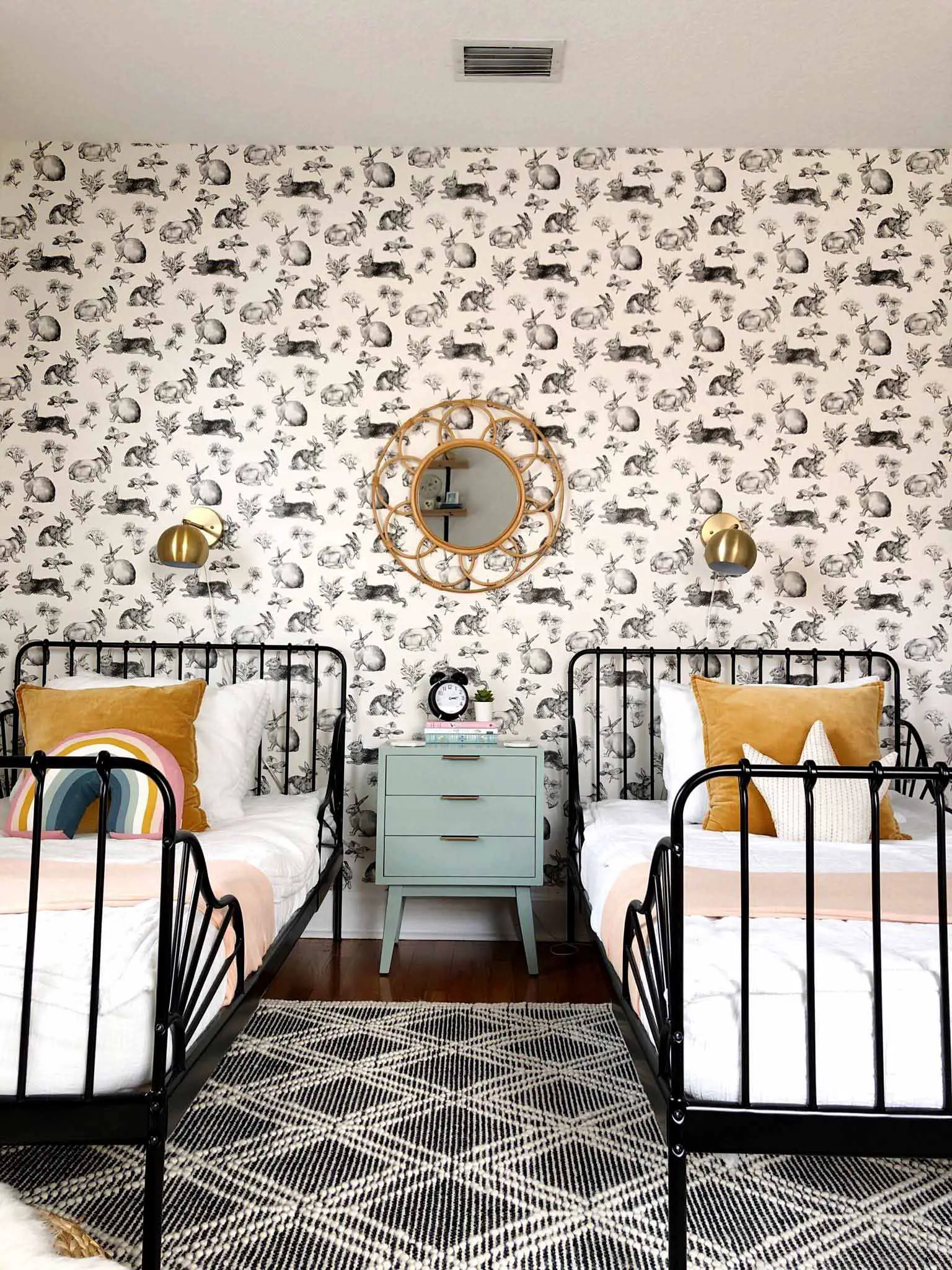 twin bedroom with rabbit wallpaper