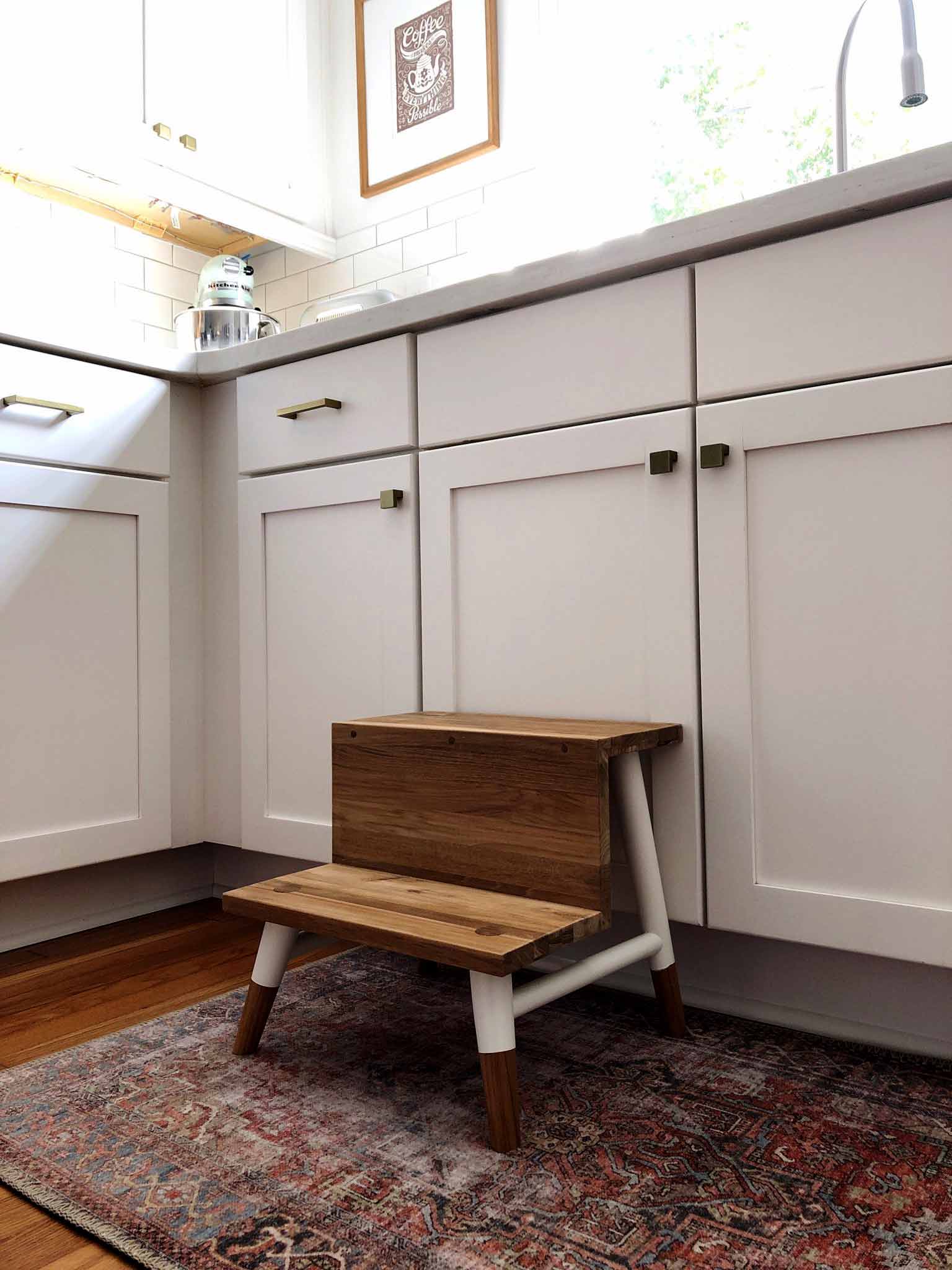 step stool next to kitchen cabinets