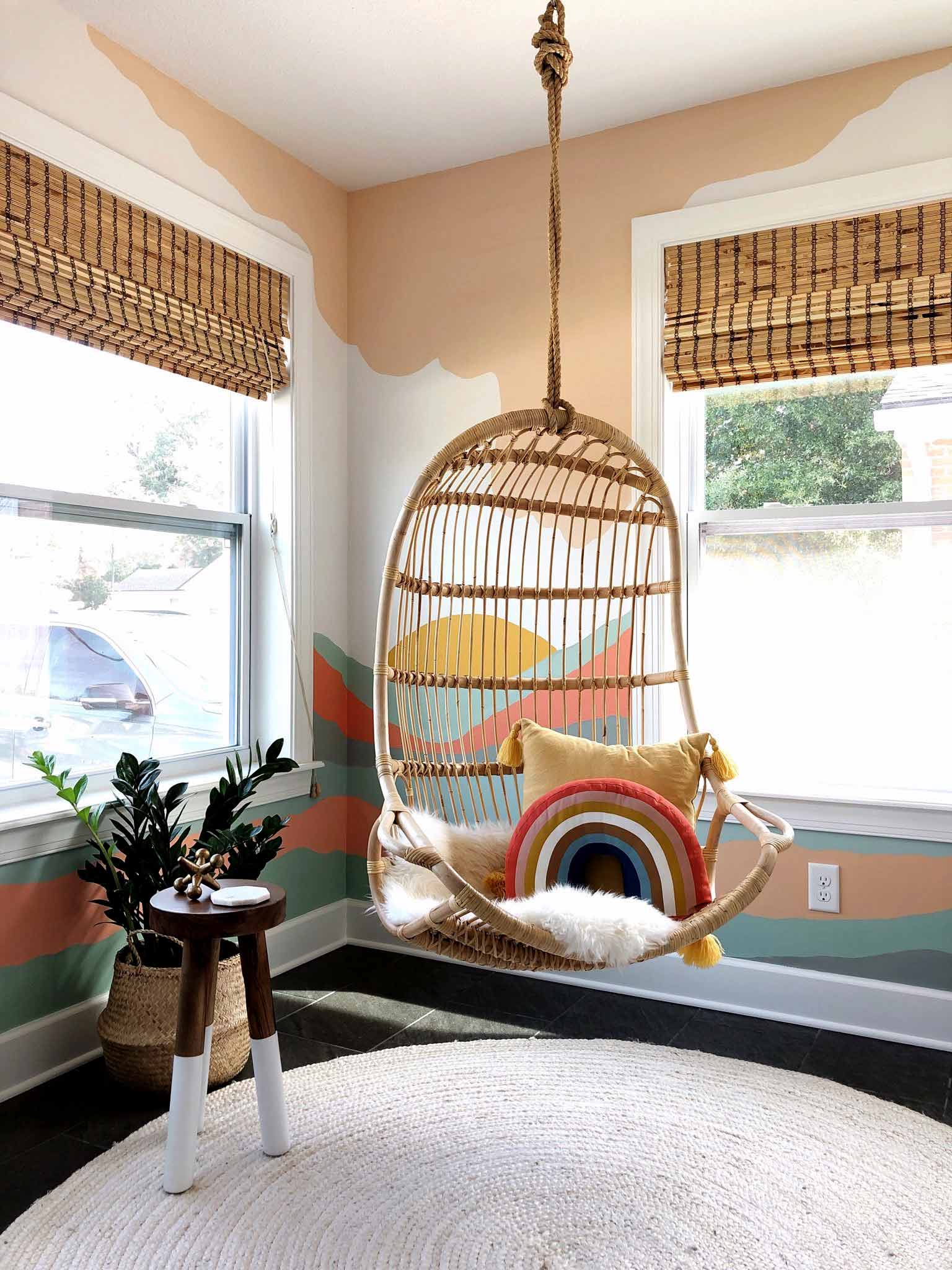 playroom with hanging chair and mural