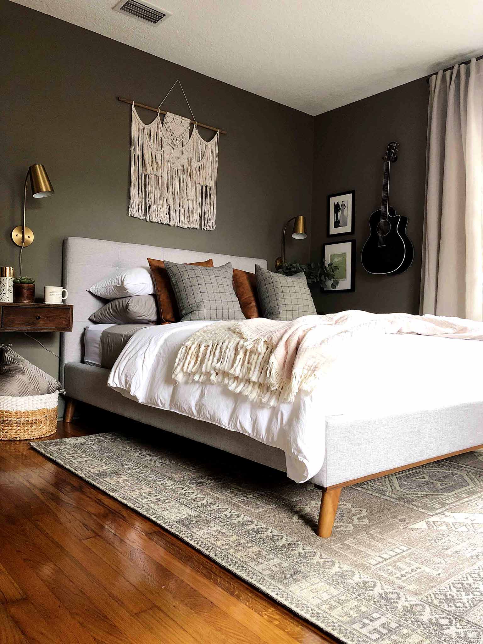 neutral master bedroom with upholstered bed