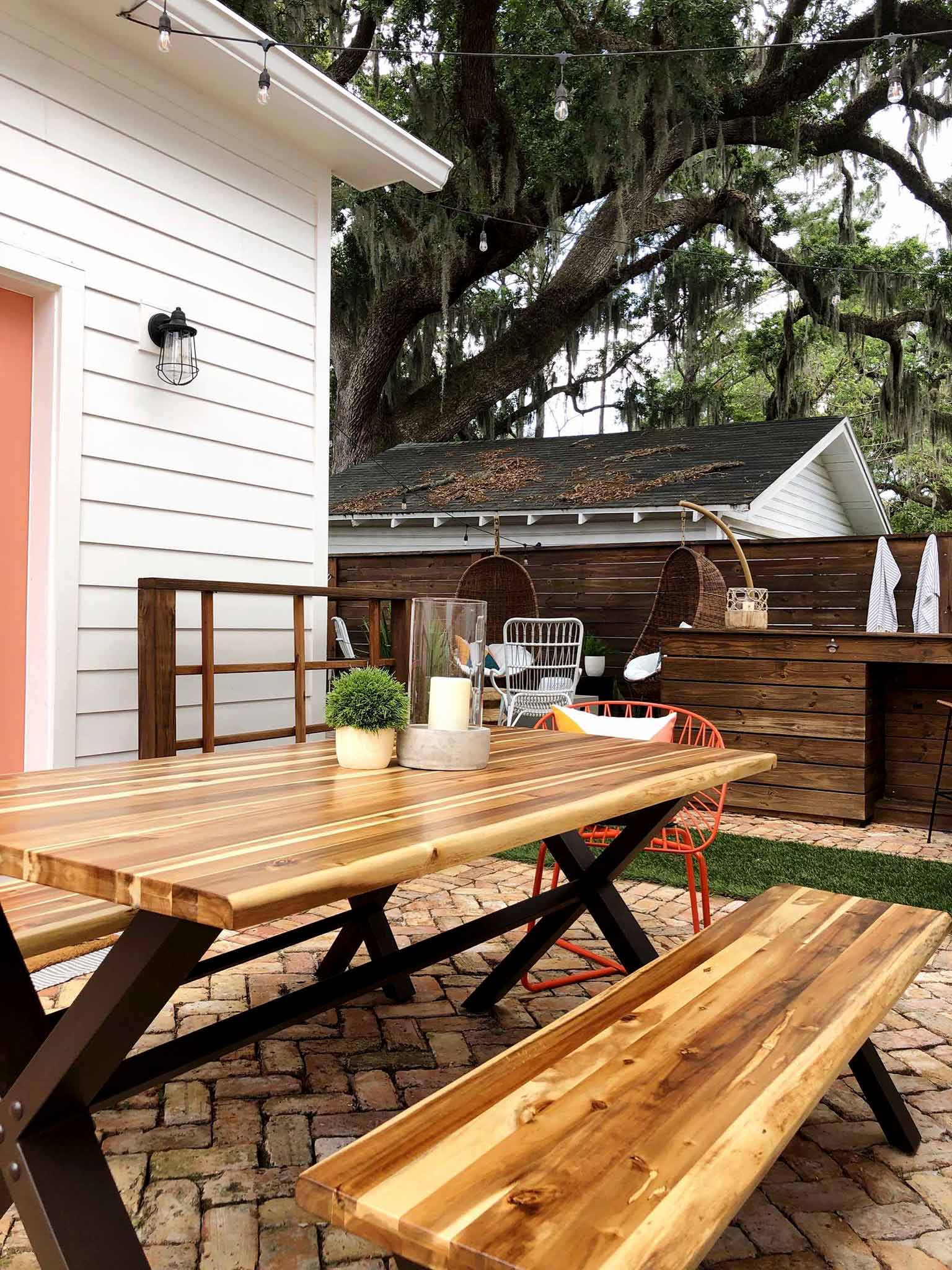 brick patio with table and benches