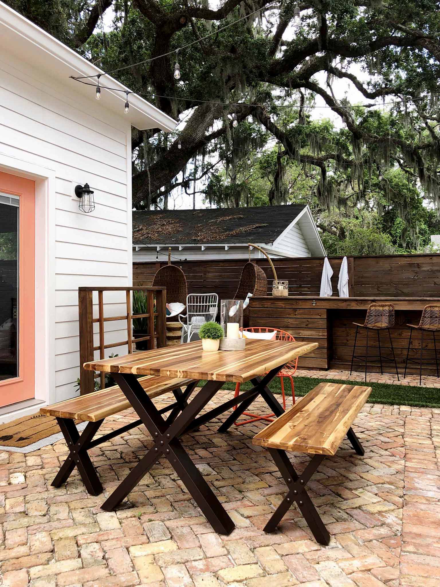 brick patio with table and benches