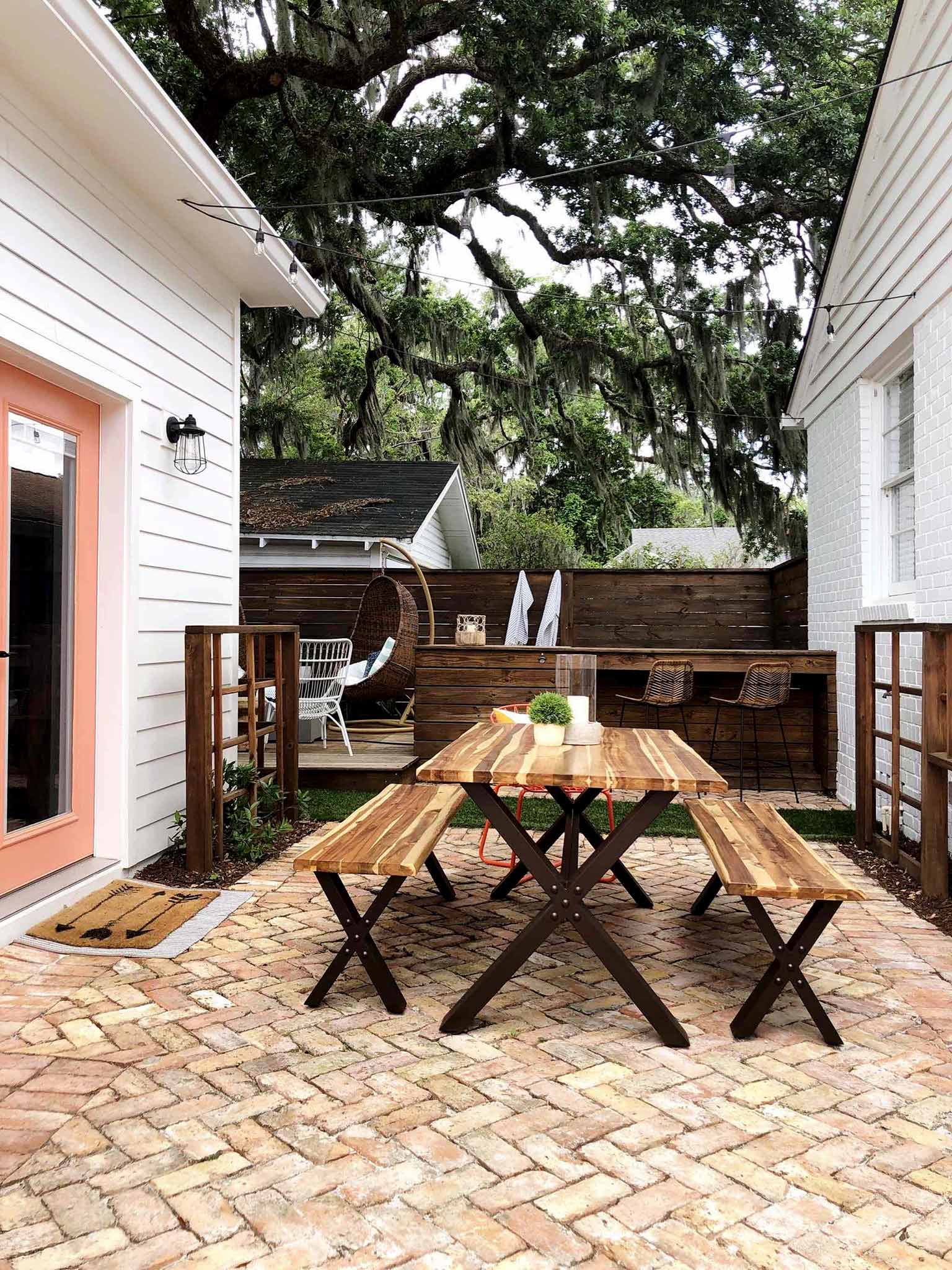 brick patio with table and benches