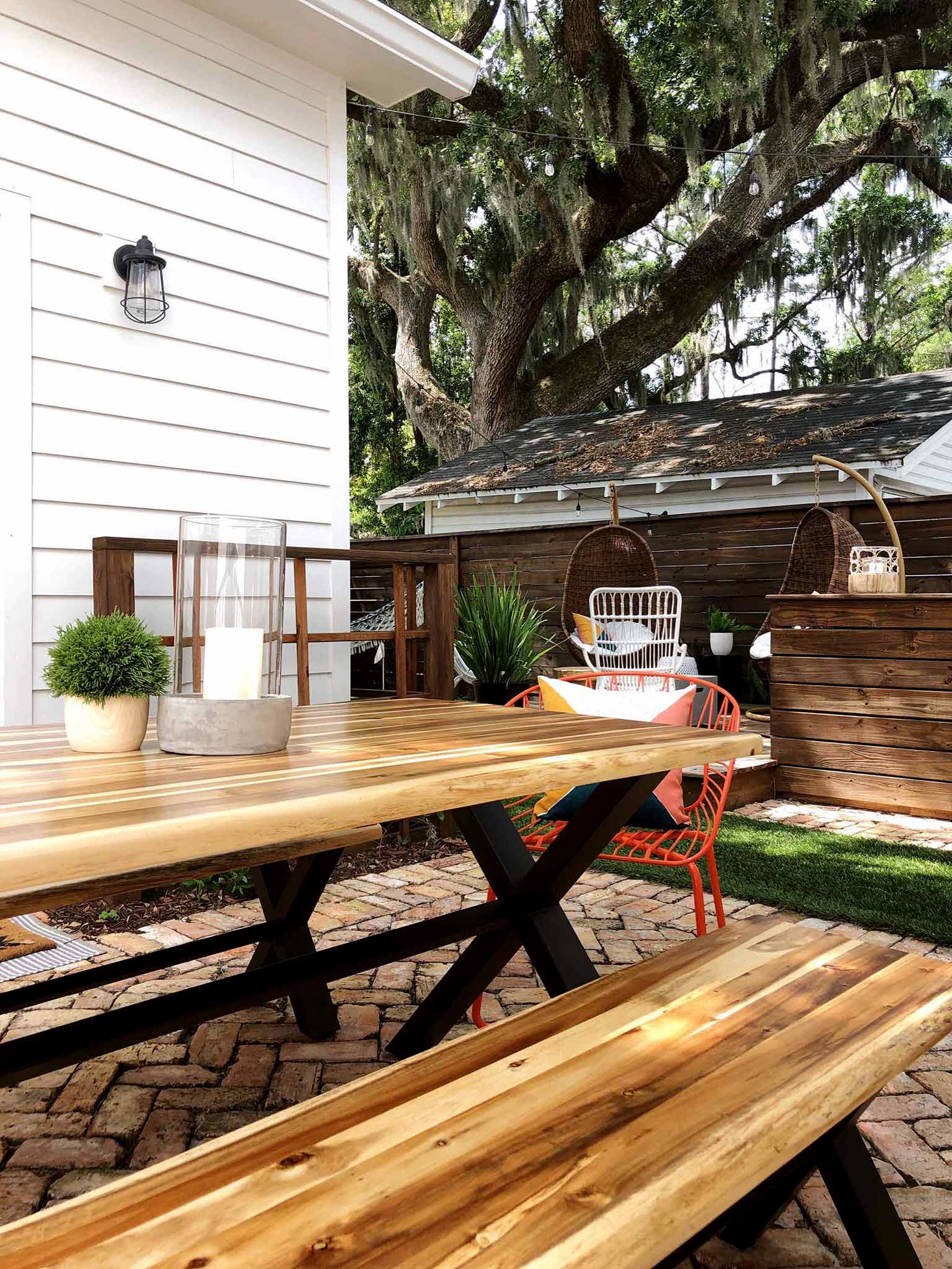 brick patio with table and benches