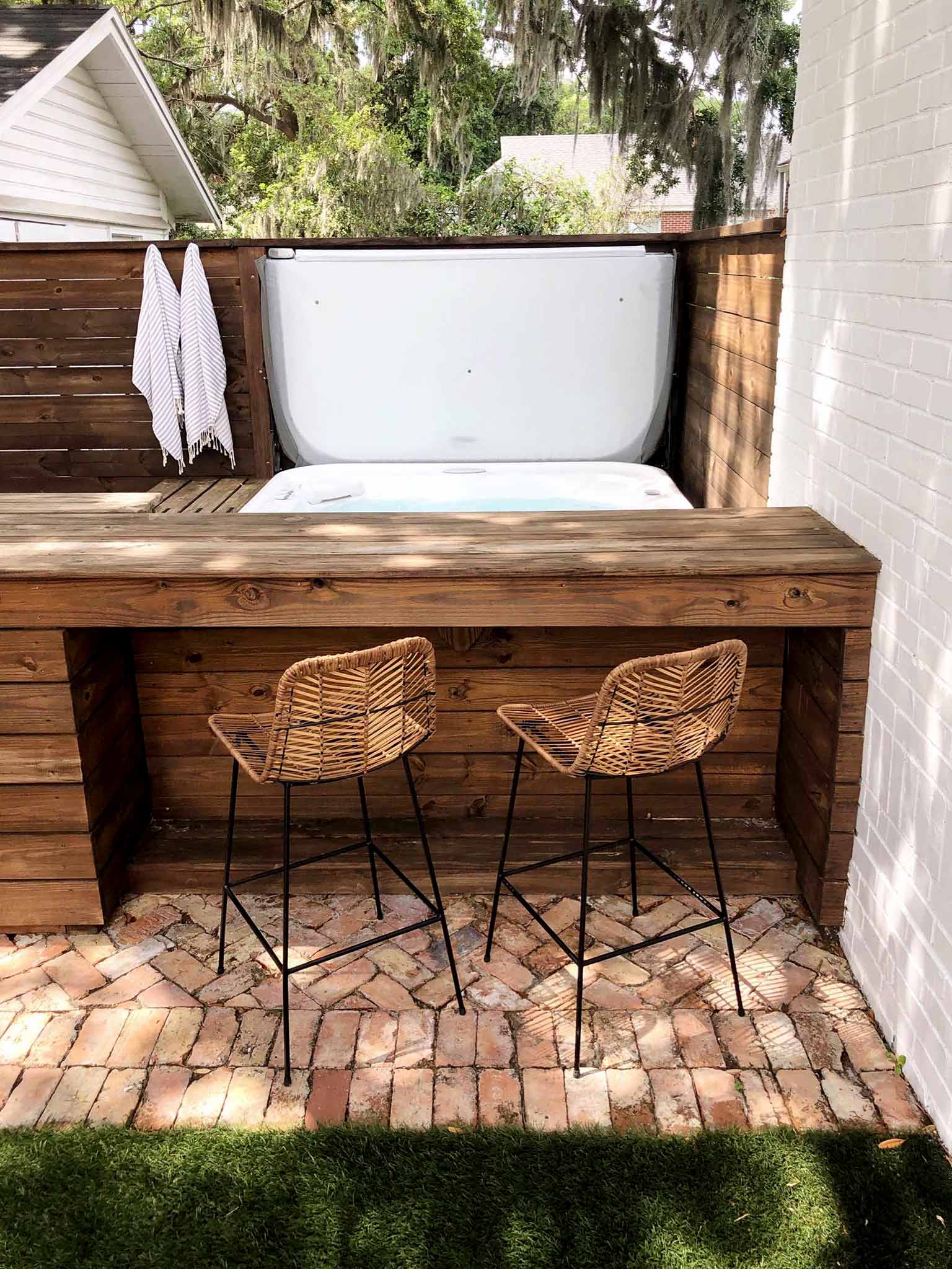 outdoor bar with bar stools and hot tub