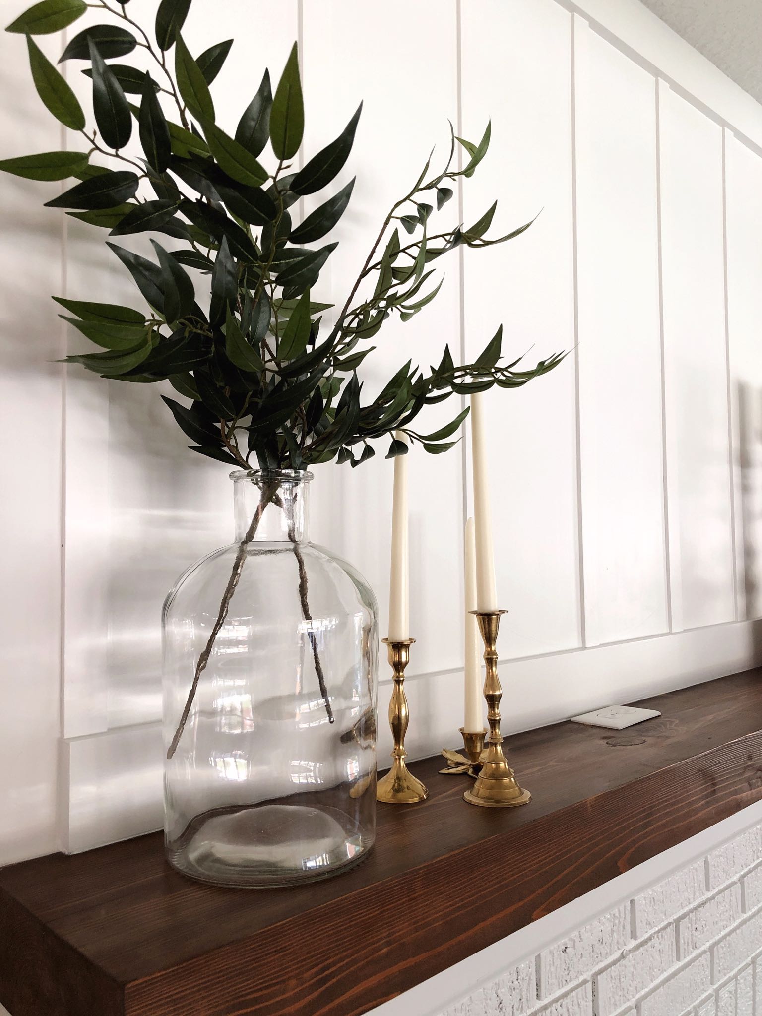 glass vase and brass candlesticks