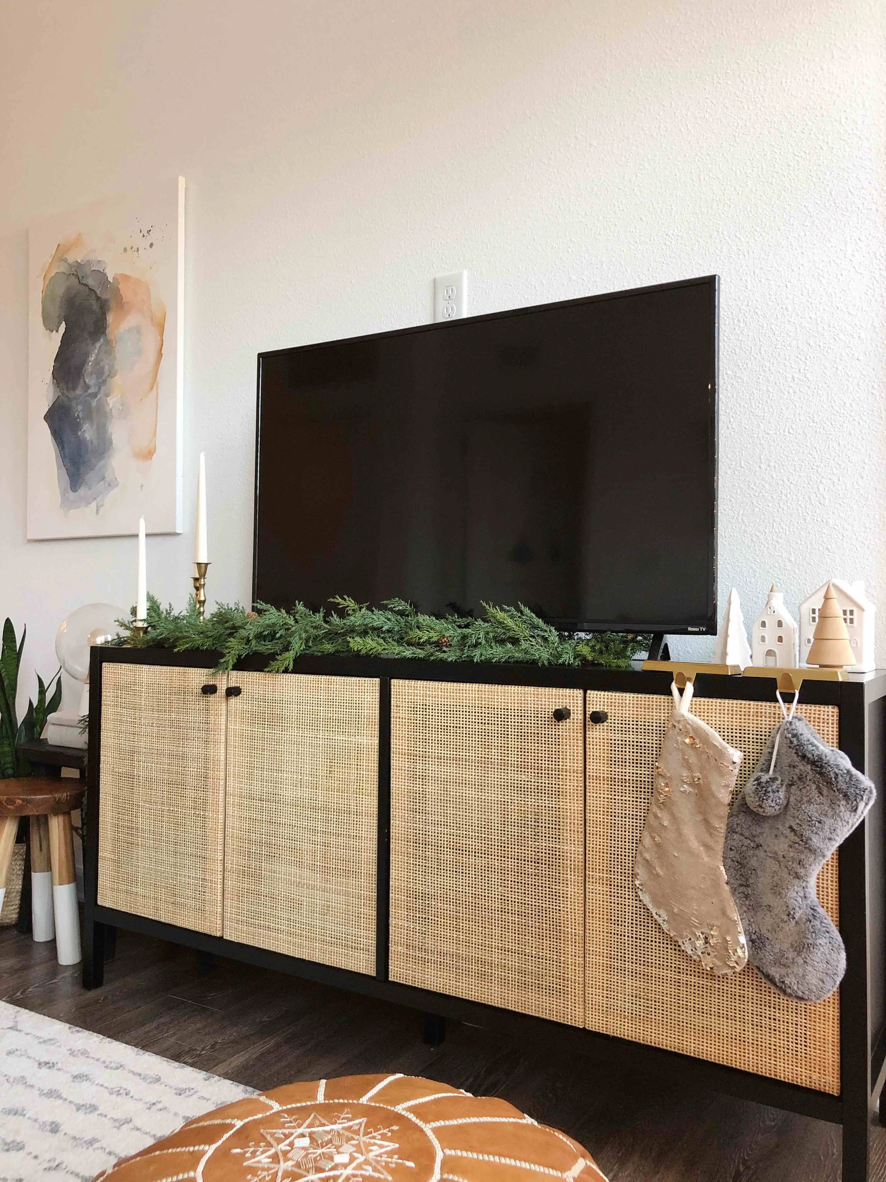 decorated media console with garland