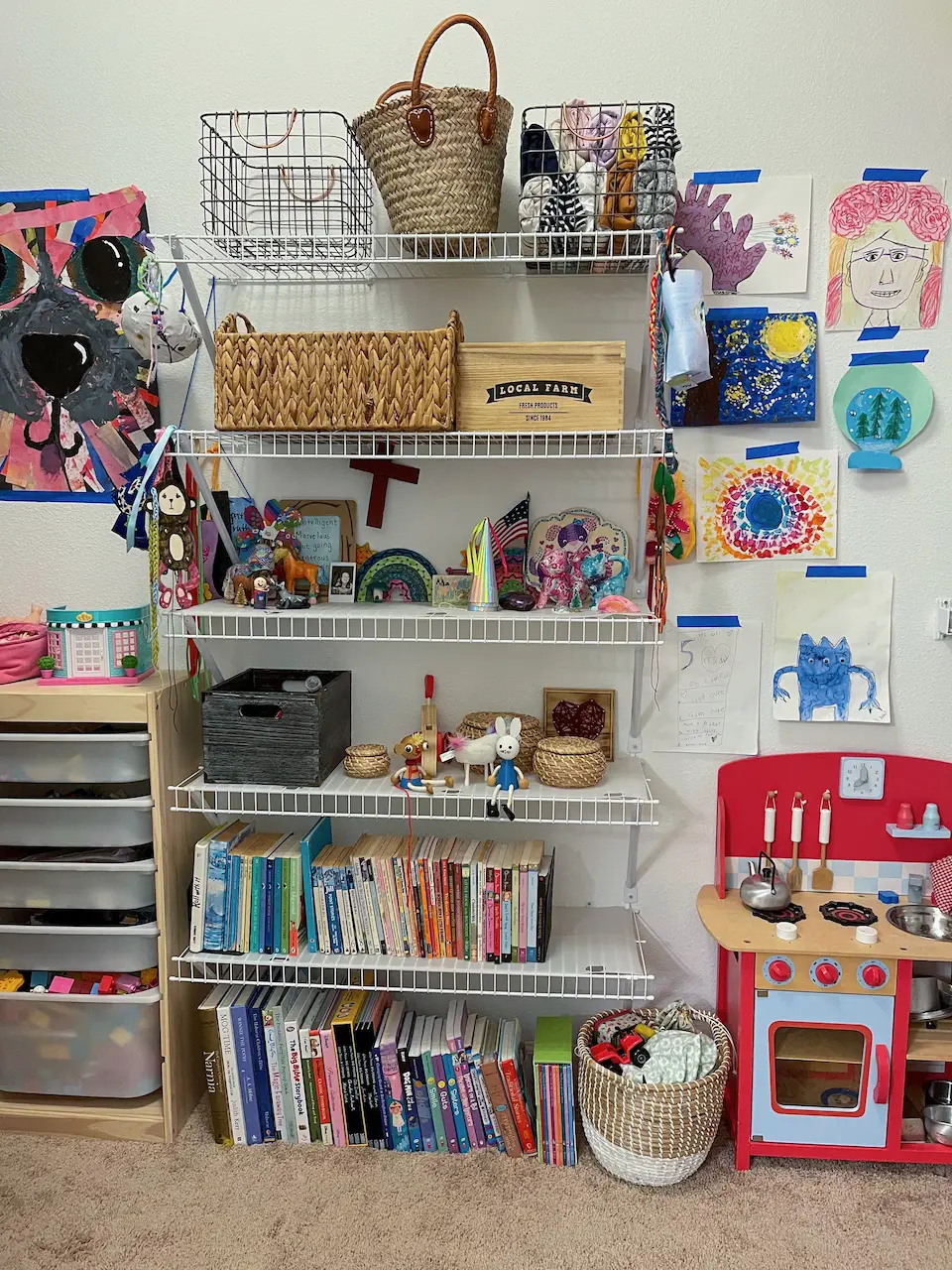 kids playroom closet with art on the walls