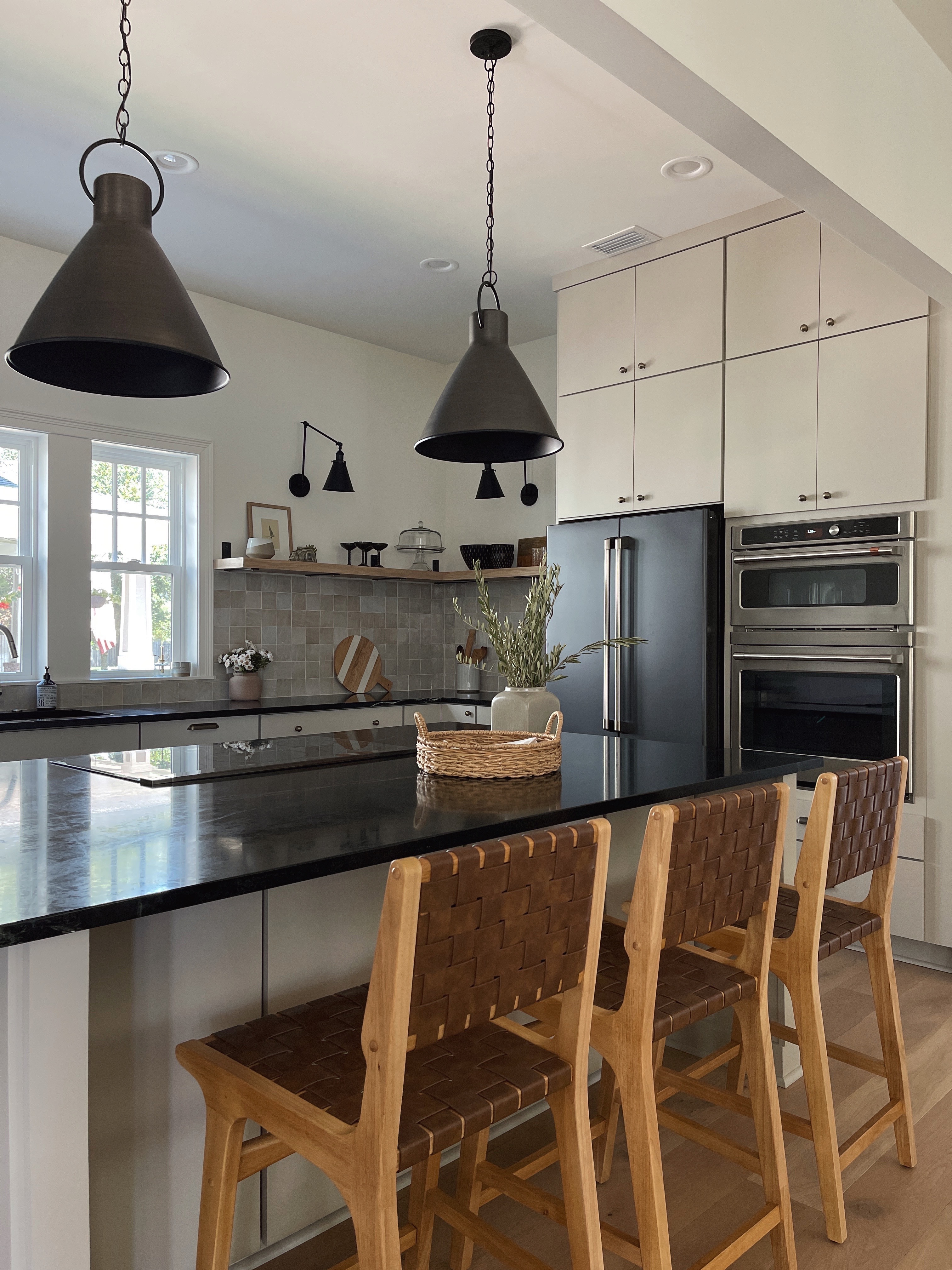 organic modern style kitchen with greige cabinets and soapstone countertops