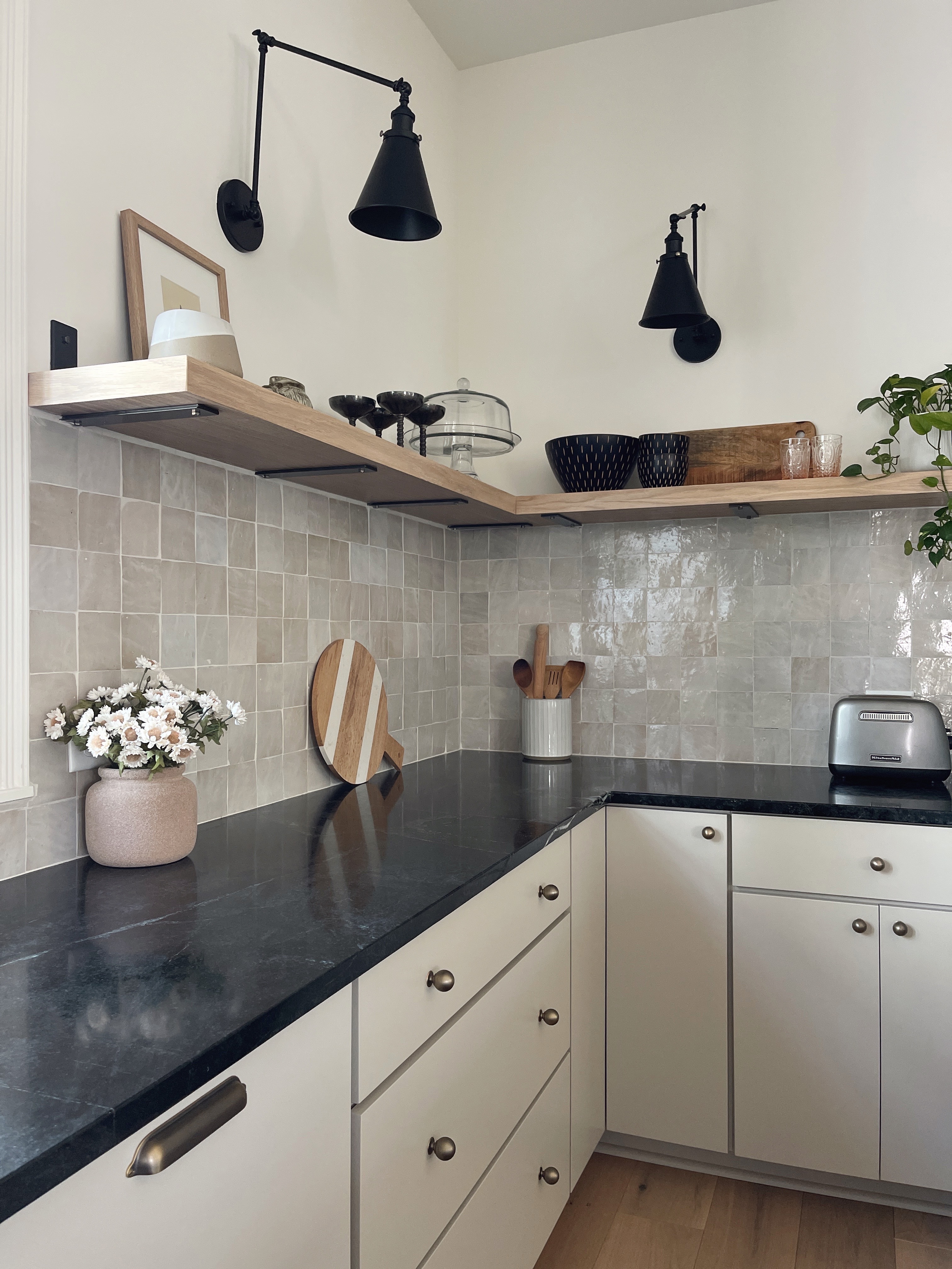 organic modern style kitchen with greige cabinets and soapstone countertops