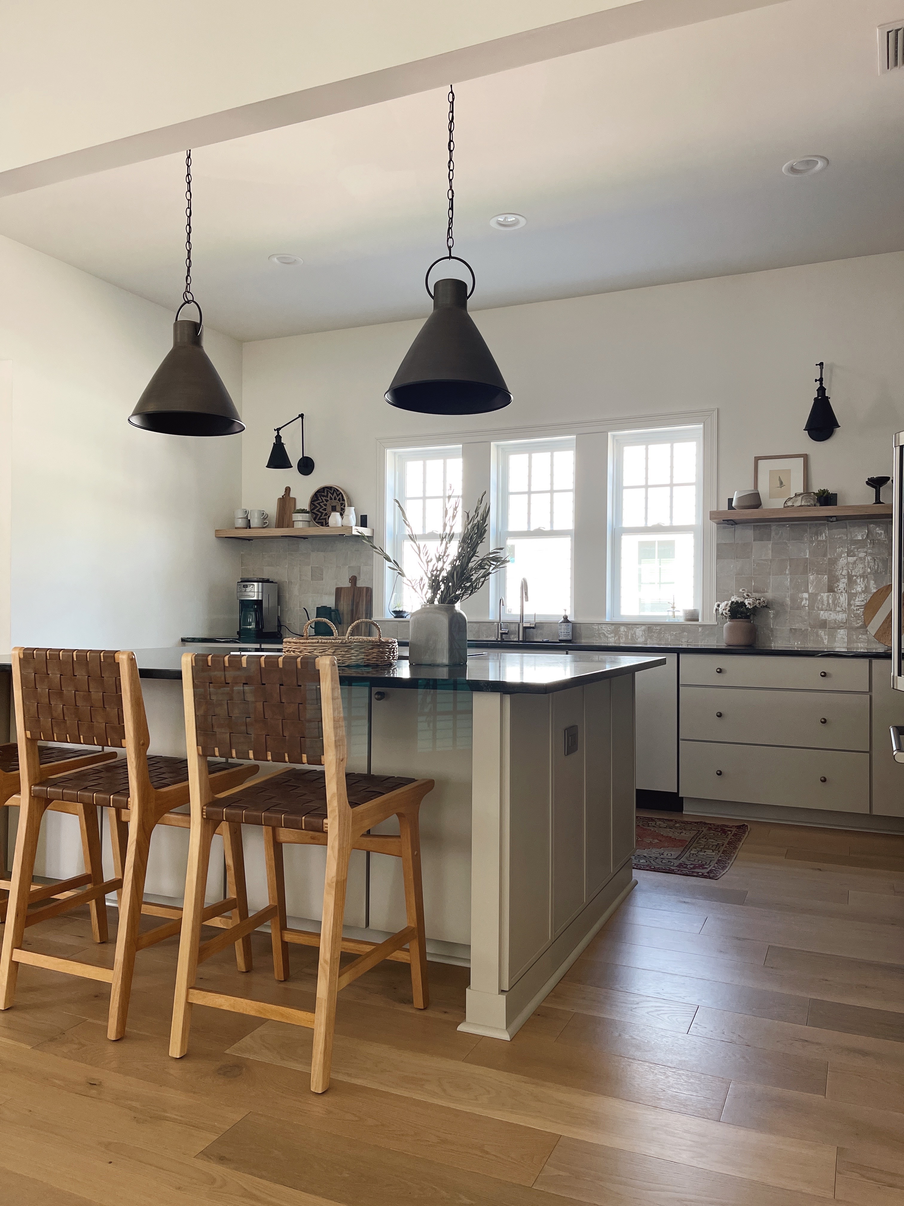 organic modern style kitchen with greige cabinets and soapstone countertops