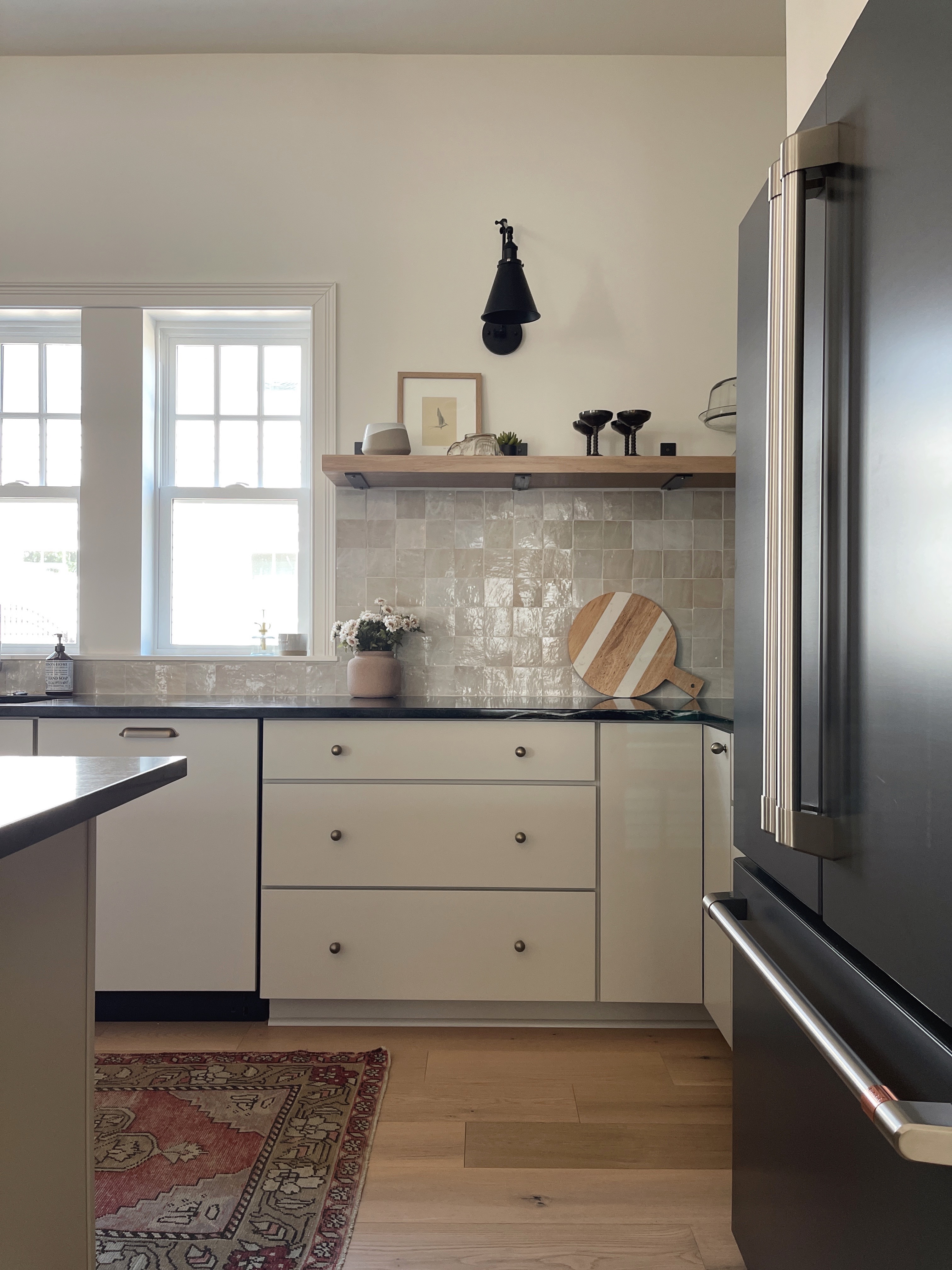 organic modern style kitchen with greige cabinets and soapstone countertops