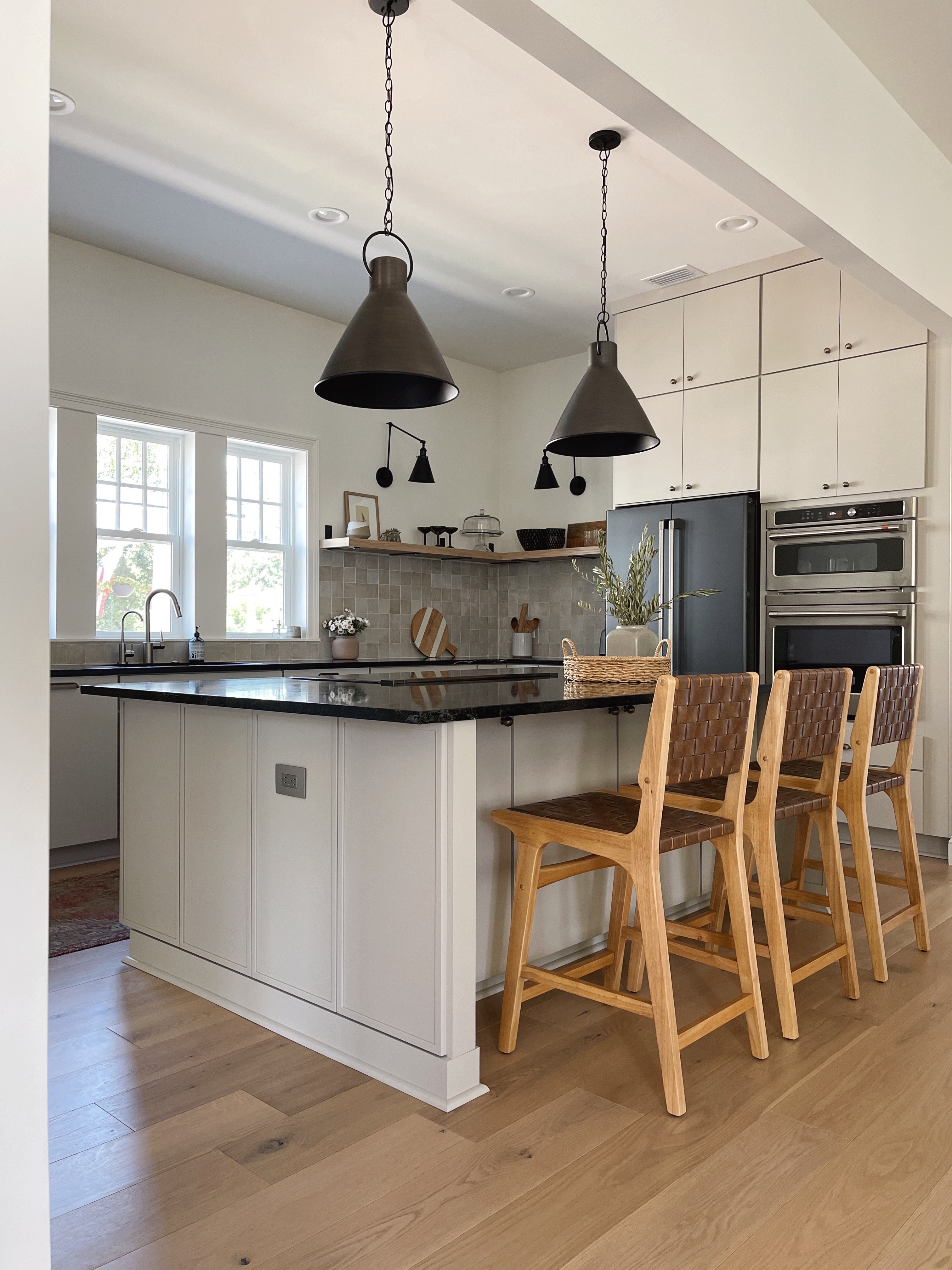 organic modern style kitchen with greige cabinets and soapstone countertops