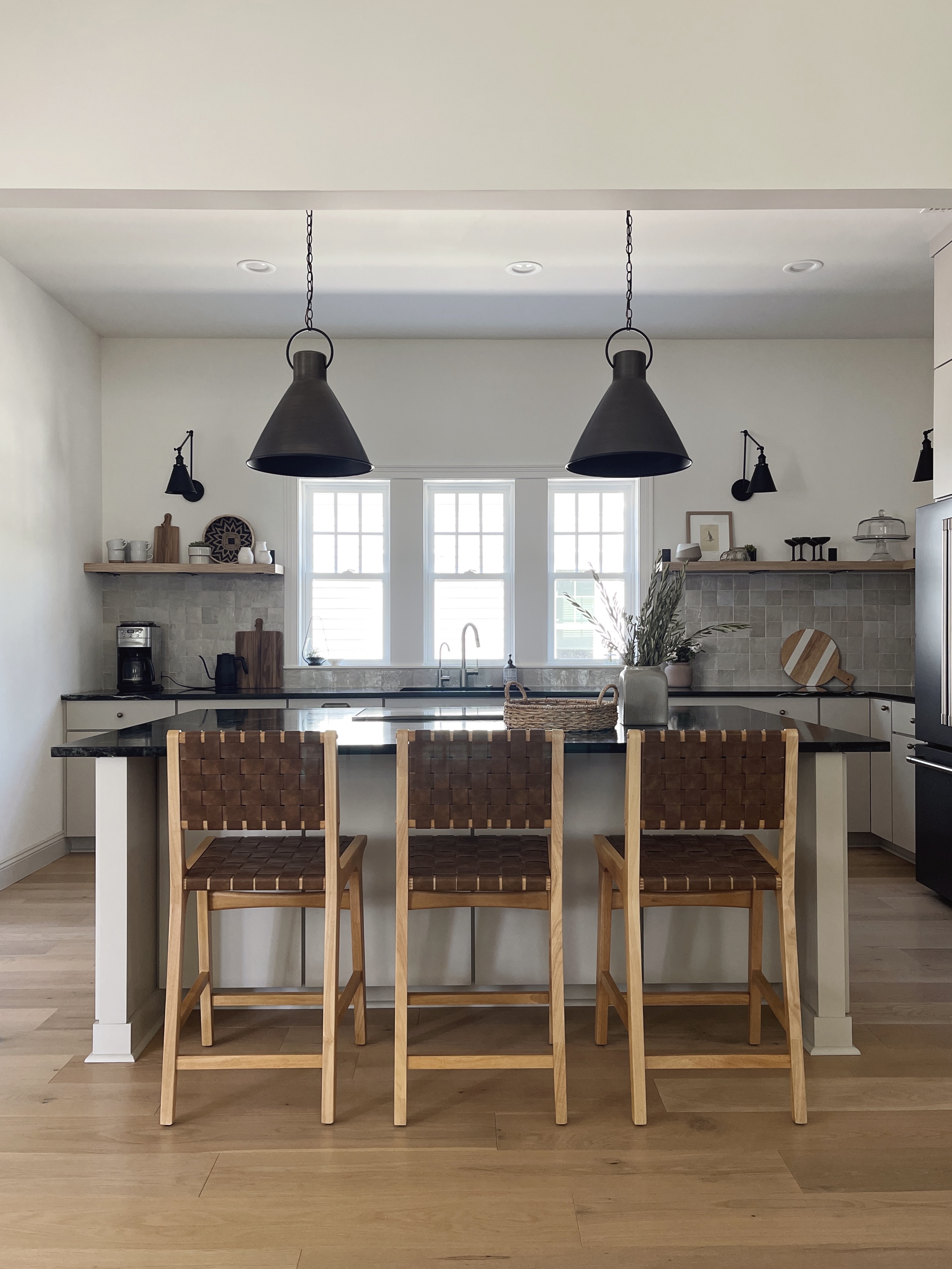 organic modern style kitchen with greige cabinets and soapstone countertops